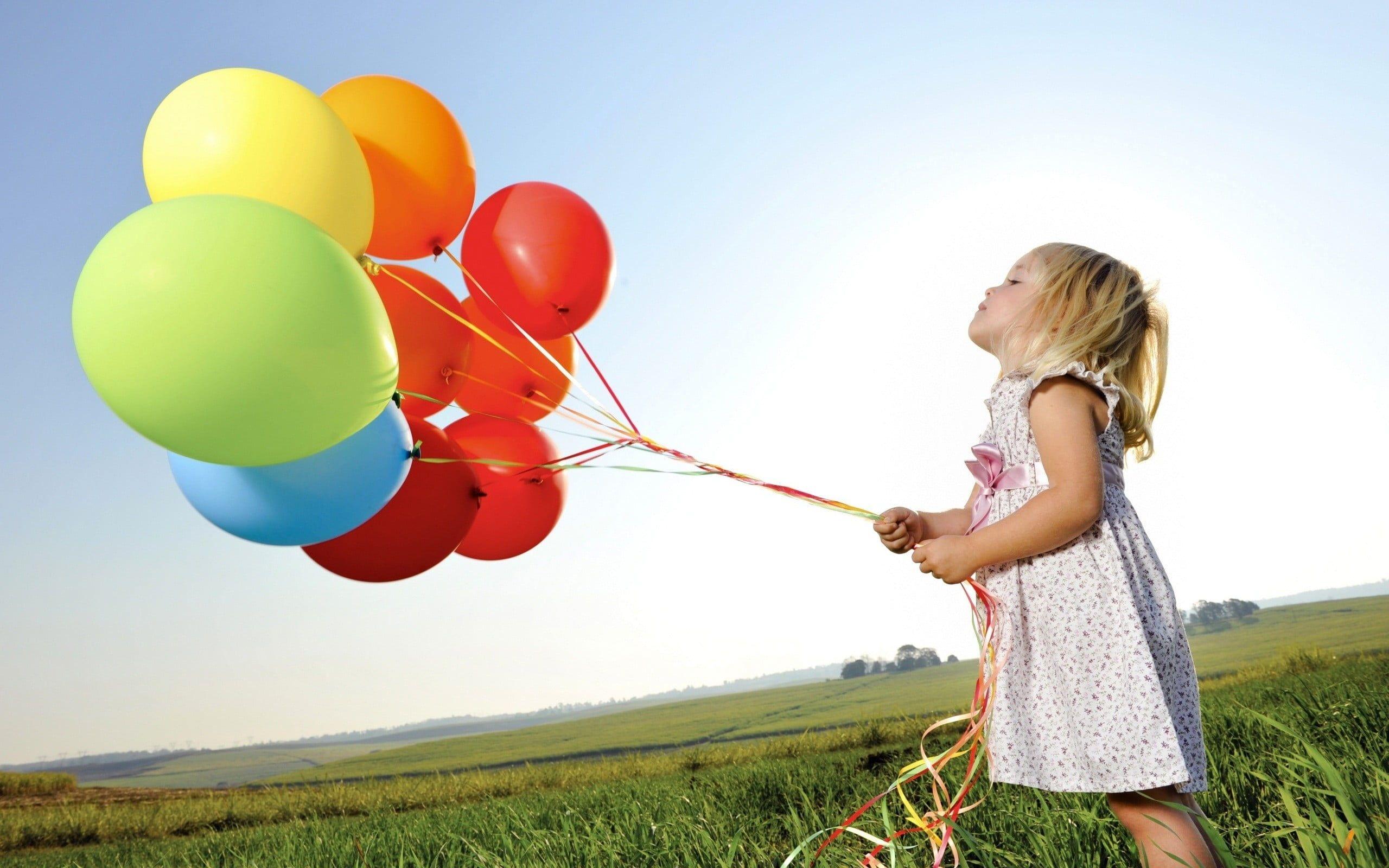 2560x1600 Girl In White Dress Holding Assorted Color Balloons HD