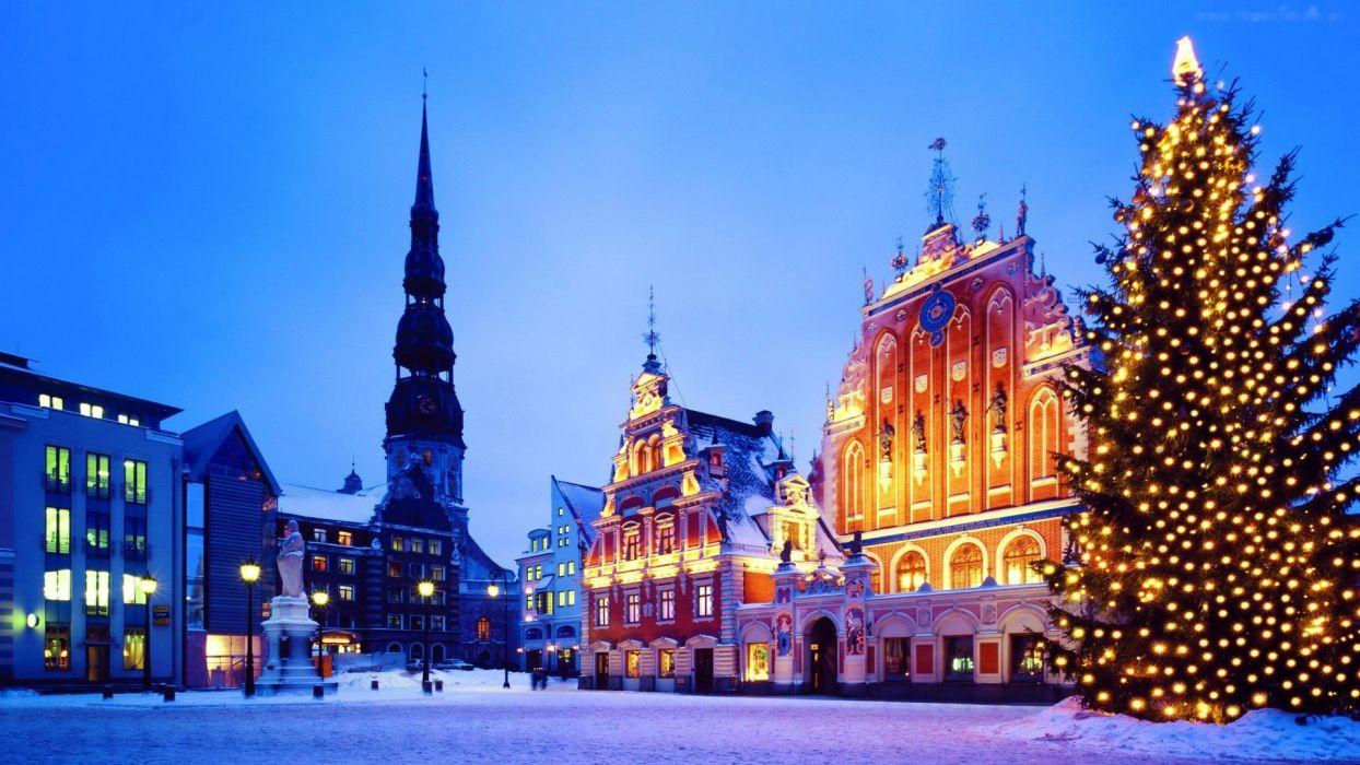 1244x700 Riga Latvia buildings houses church bell tower square tree