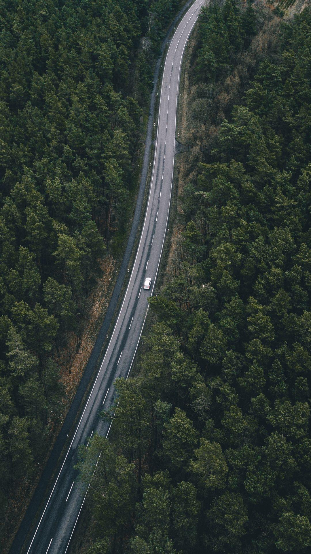 1080x1920 Download wallpaper 1080x1920 road, trees, top view samsung
