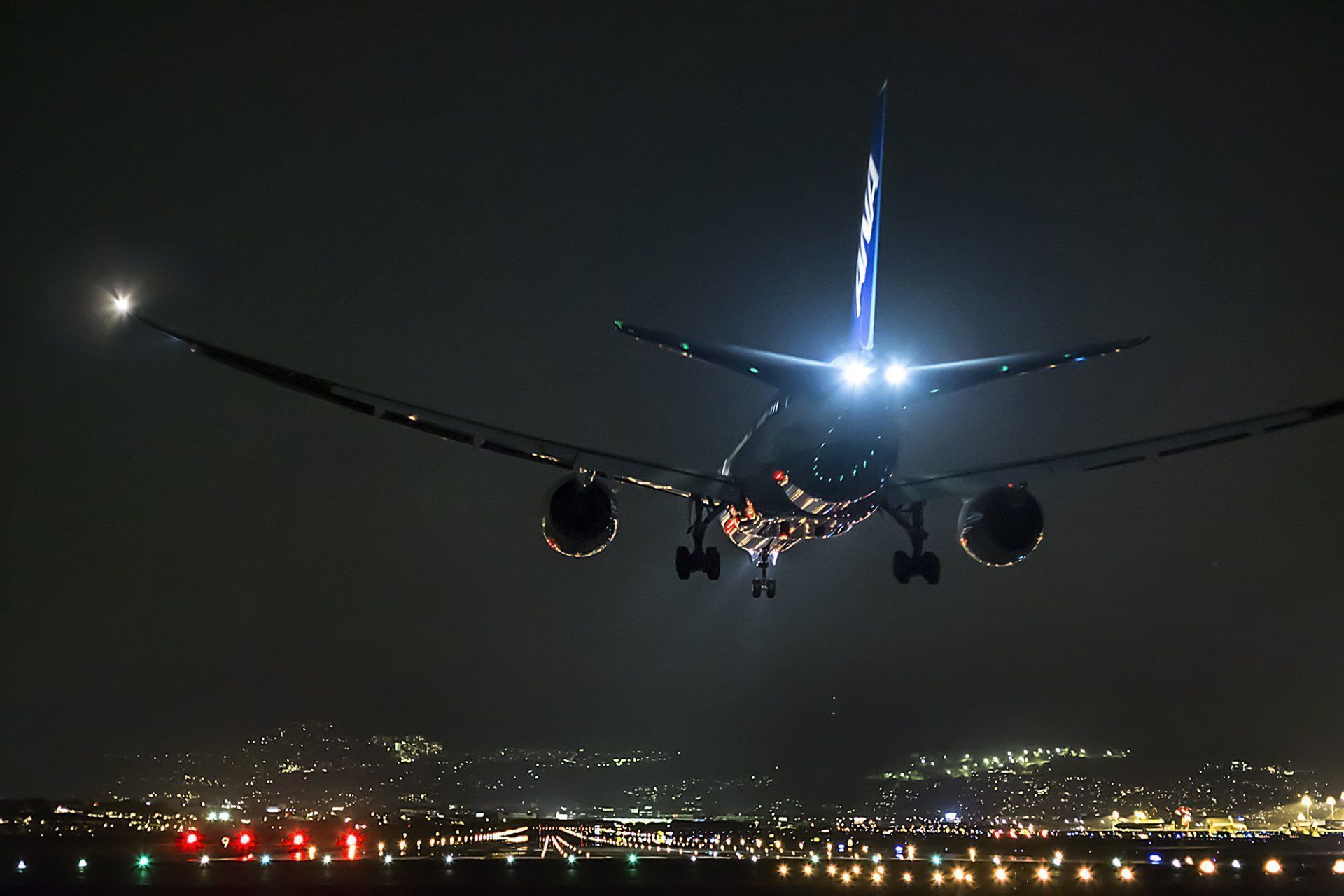 1920x1280 Nighttime Cityscape: HD Wallpaper of Aircraft in Flight