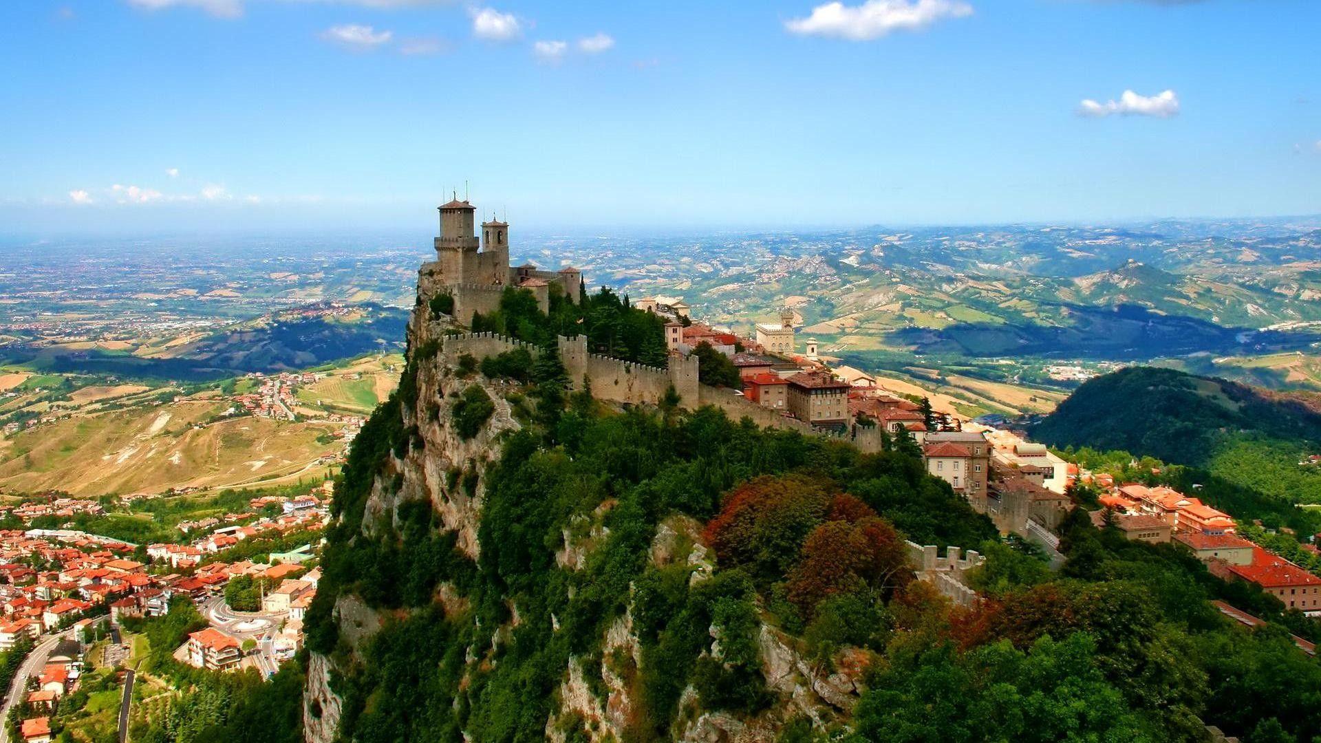 1920x1080 Other: Castle Atop Mountain Village Wall Panorama Vollage Wallpaper