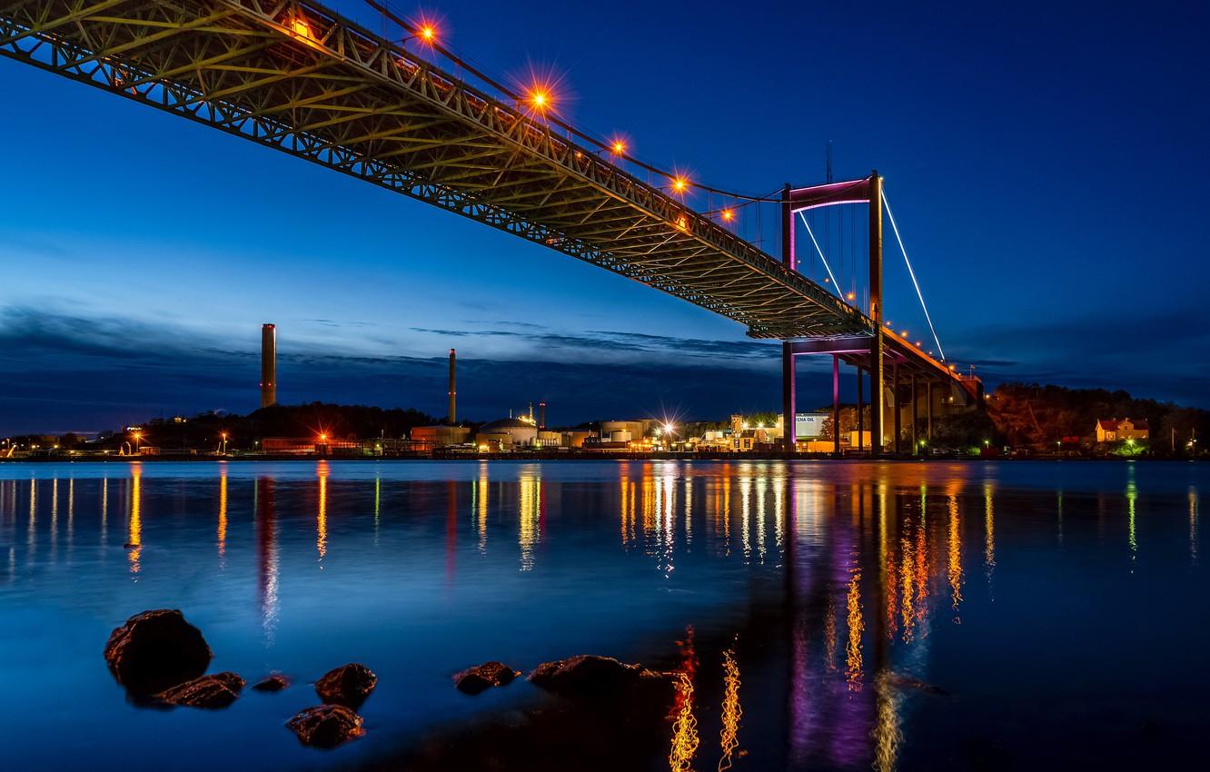 1332x850 Wallpaper night, bridge, lights, river, stones, shore, home