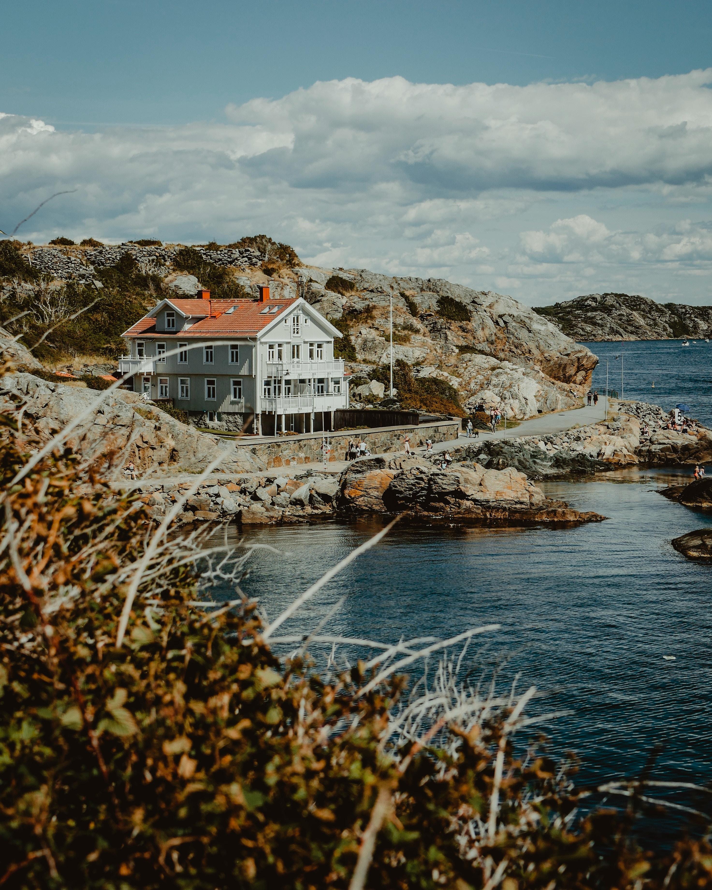 2946x3682 Download wallpaper 2946x3682 house, sea, shore, rocks
