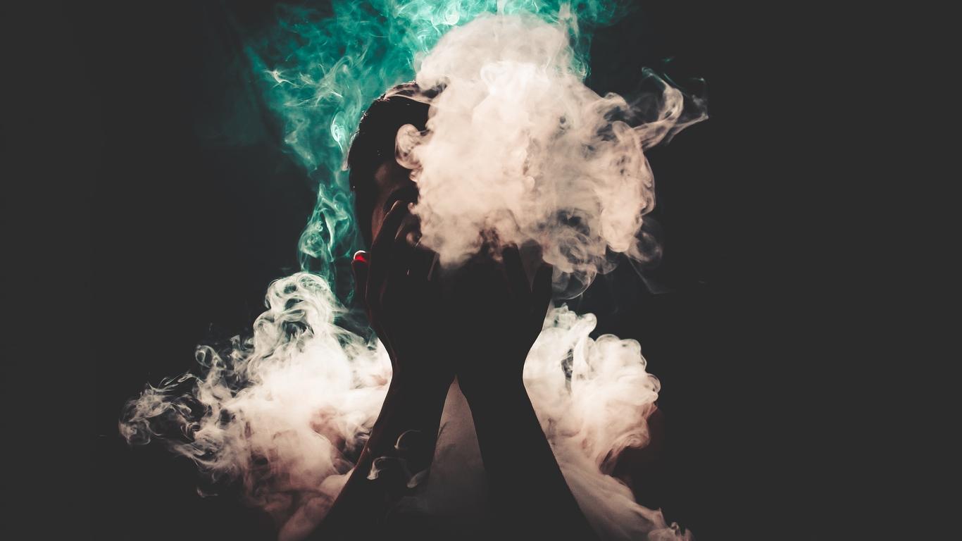 1366x768 Download wallpaper 1366x768 man, smoke, hands, colorful