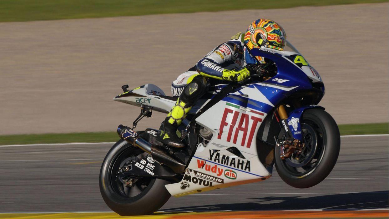 1244x700 Bikes vehicles Moto GP motorbikes wheelie Valentino Rossi
