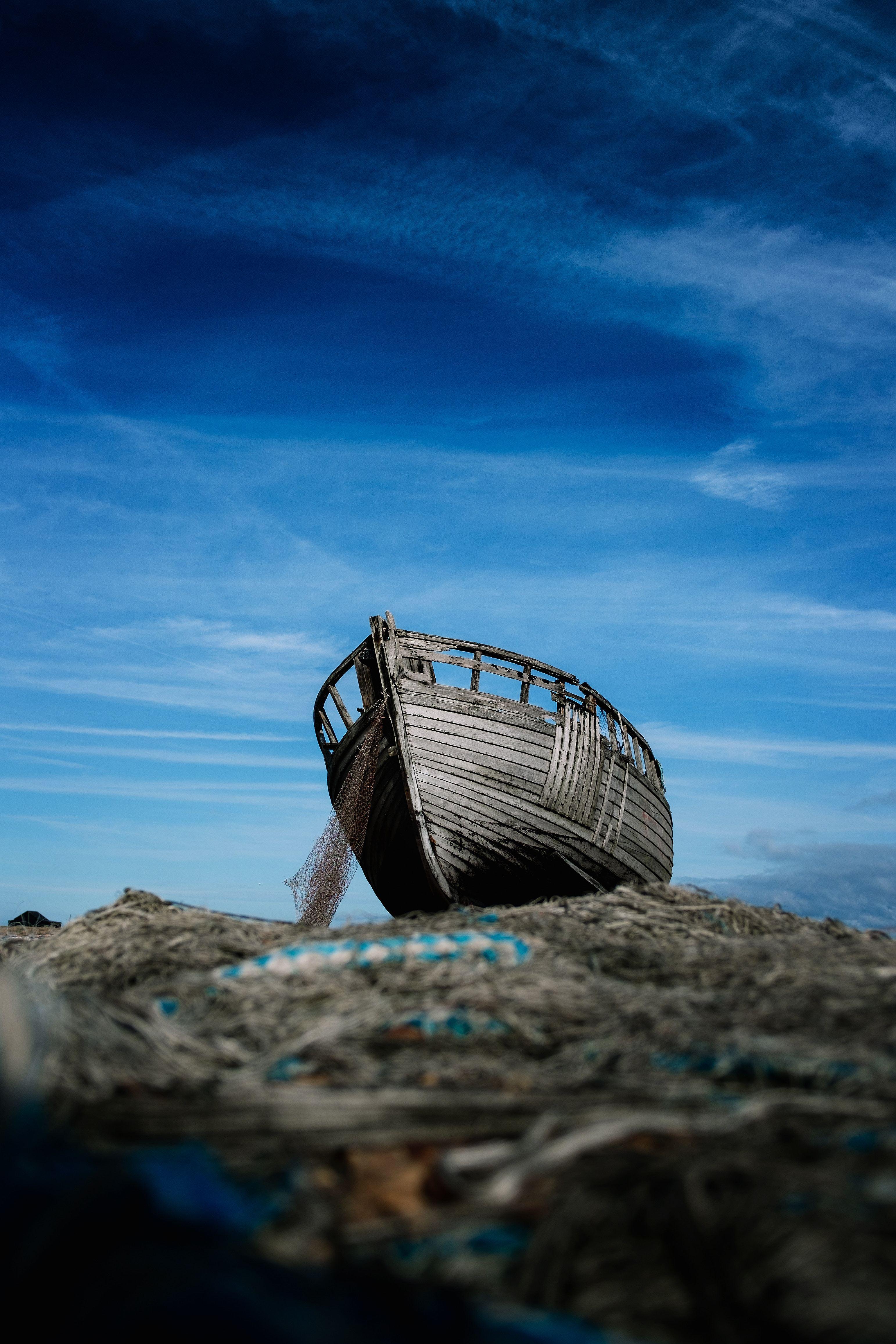 3085x4627 Wrecked Wooden Boat and a Blue Whispy Sky Phone Background