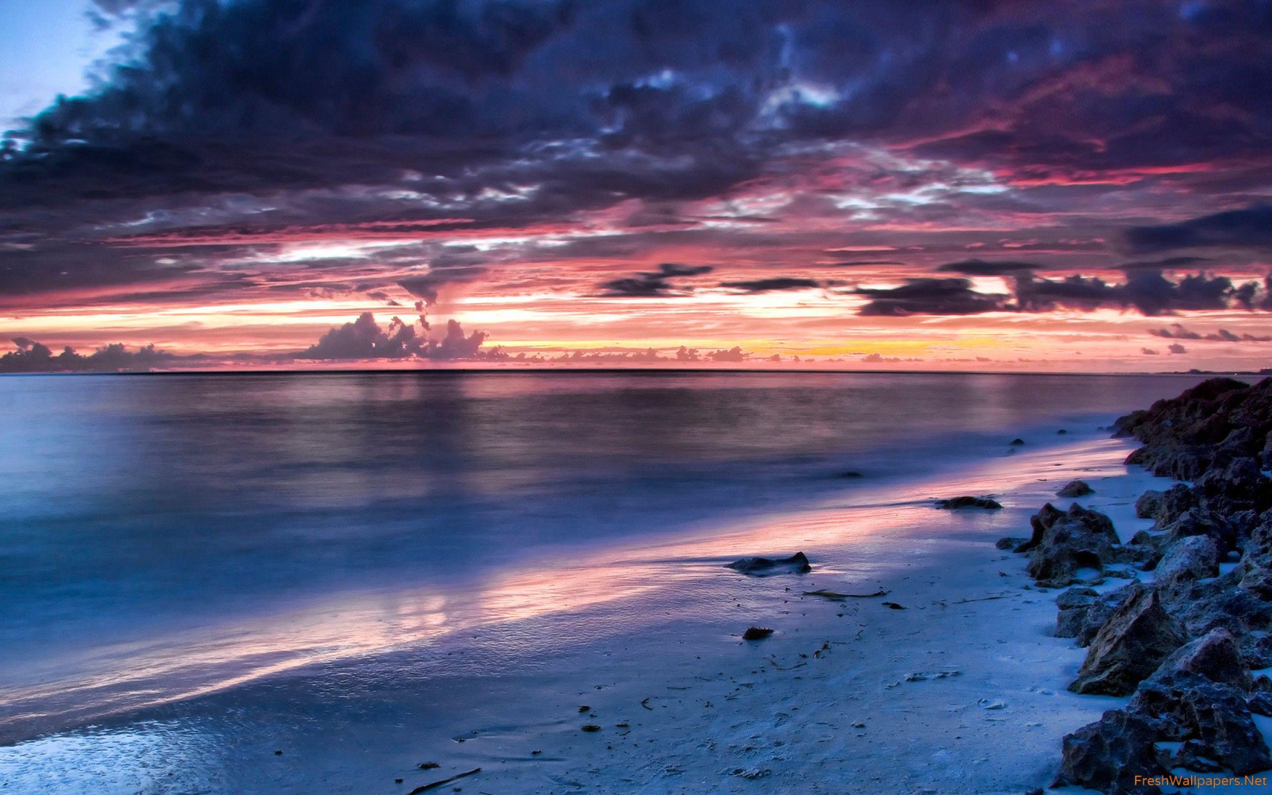 2560x1600 Blue Clouds Nature Ocean Pink Rocks Sea Skies Sunrise