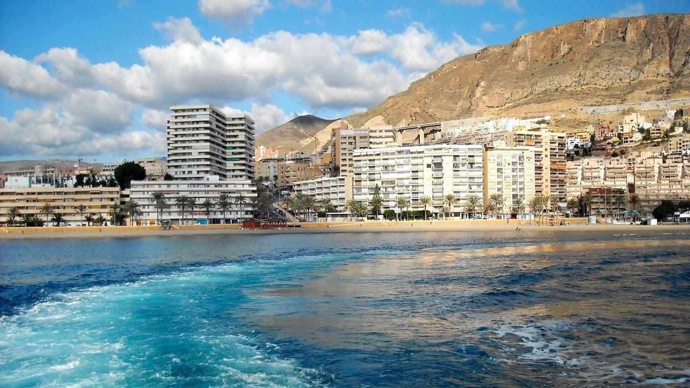 1366x768 Download wallpaper 1366x768 city, country, spain, andalusia