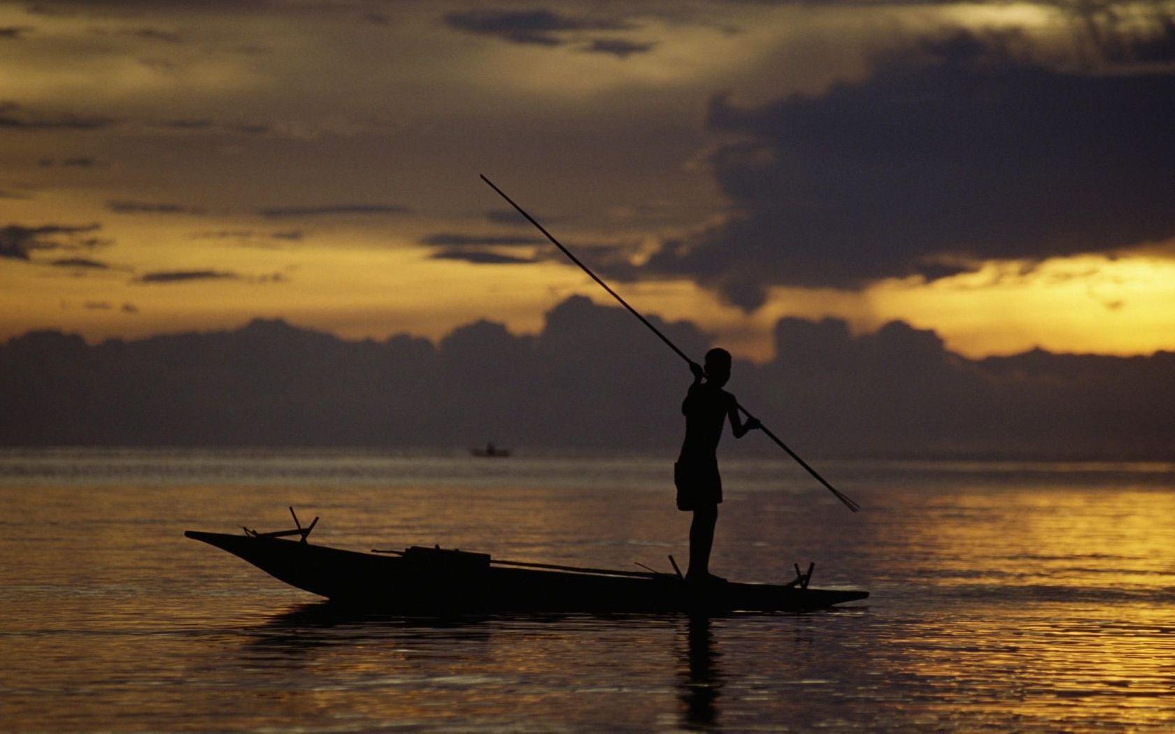 1680x1050 Nature: Fisherman At Sunset, Fergusson's Island, Papua New