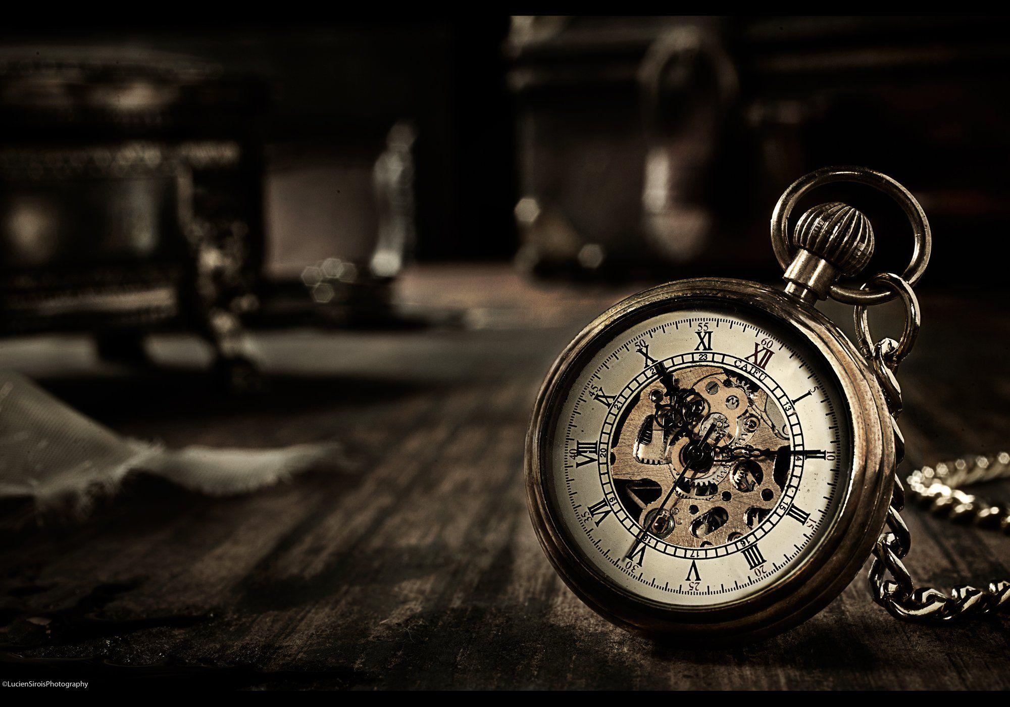 Stylish old fashioned clock on dark background  Free Stock Photo