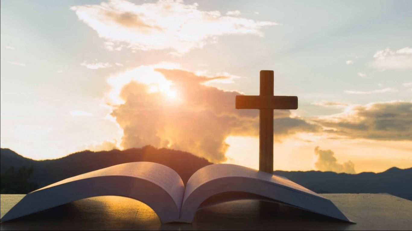 1366x768 Bible Cross On Table In White Clouds