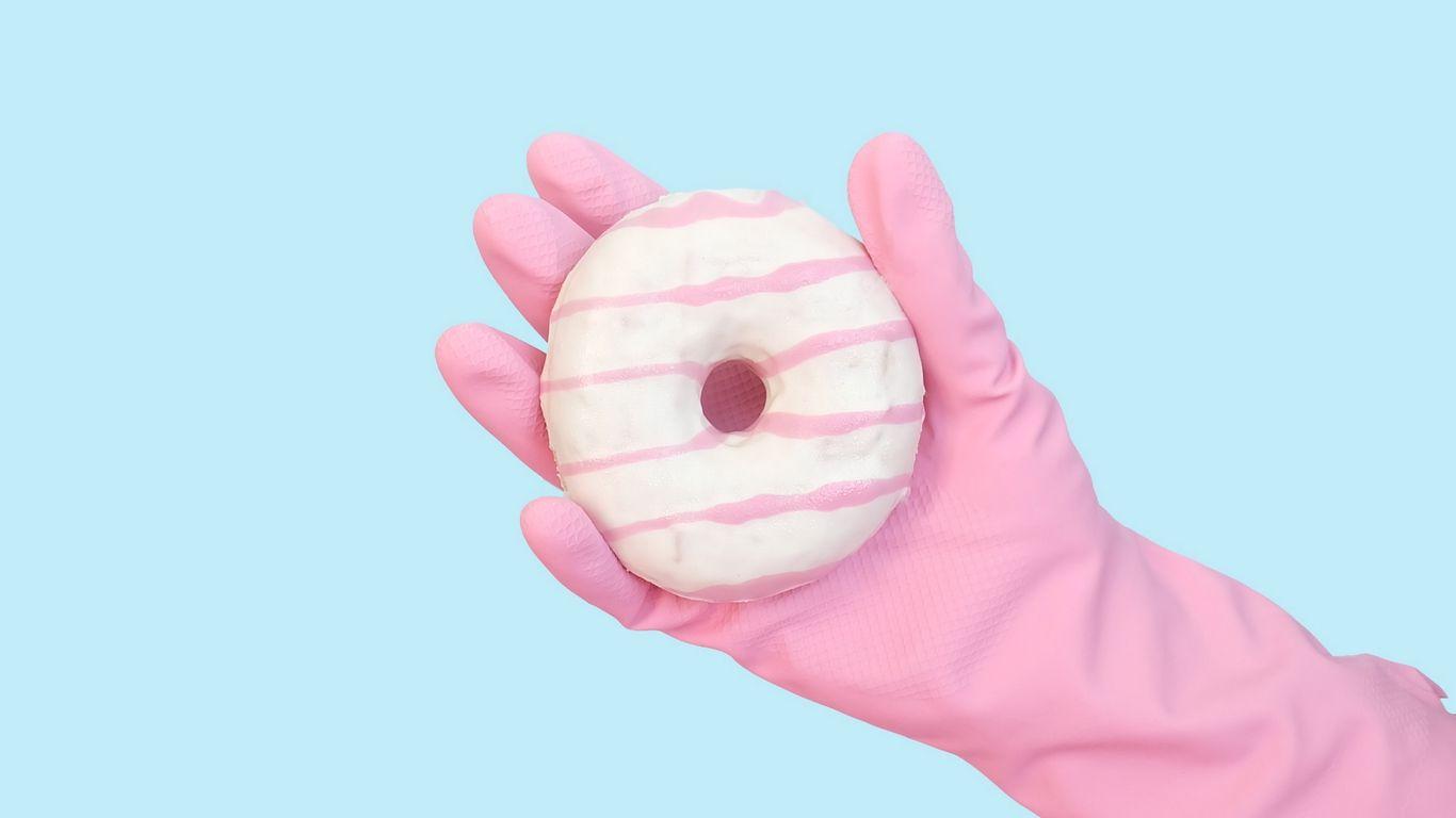 1366x768 Download wallpaper 1366x768 donut, hand, glove, minimalism