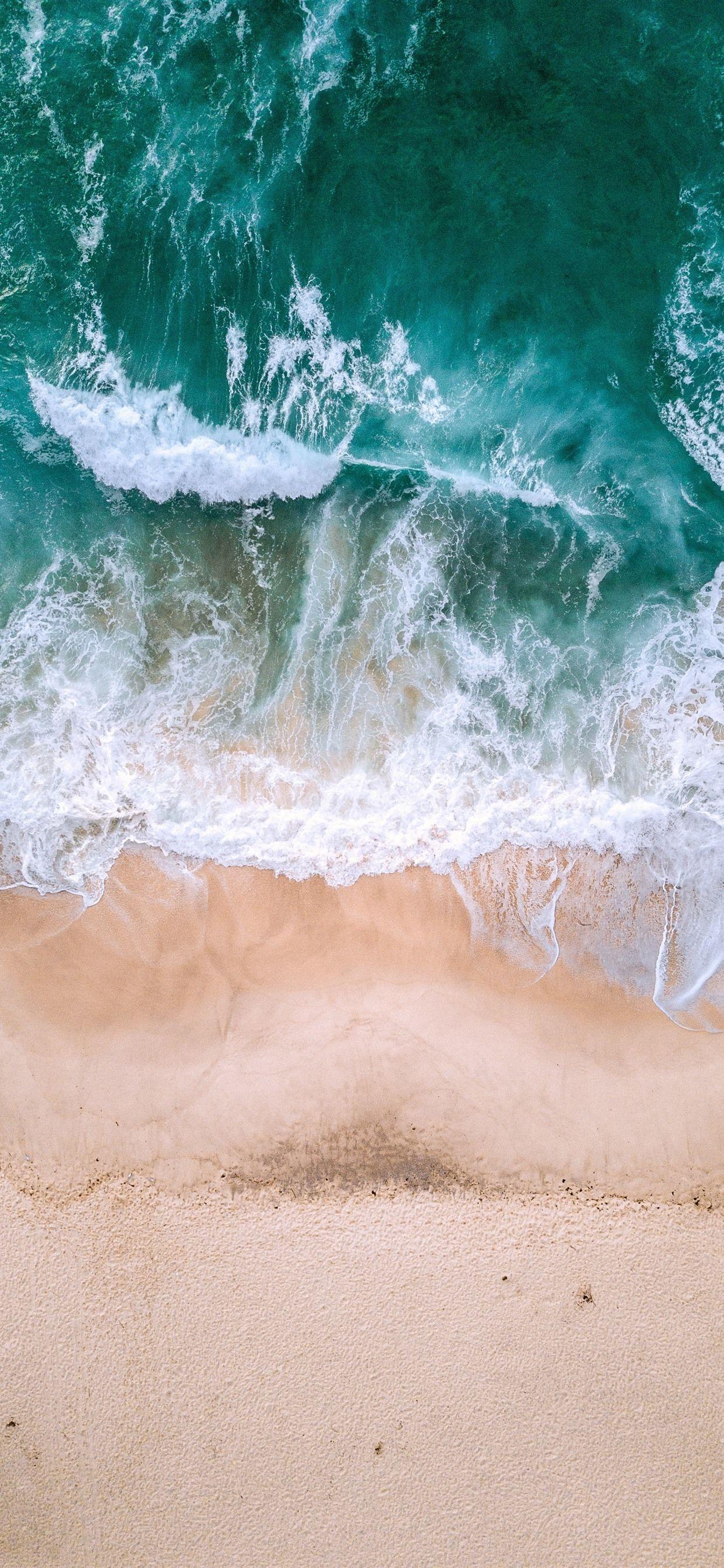 1242x2688 Beautiful beach, sea, waves, foam, top view 1242x2688 iPhone