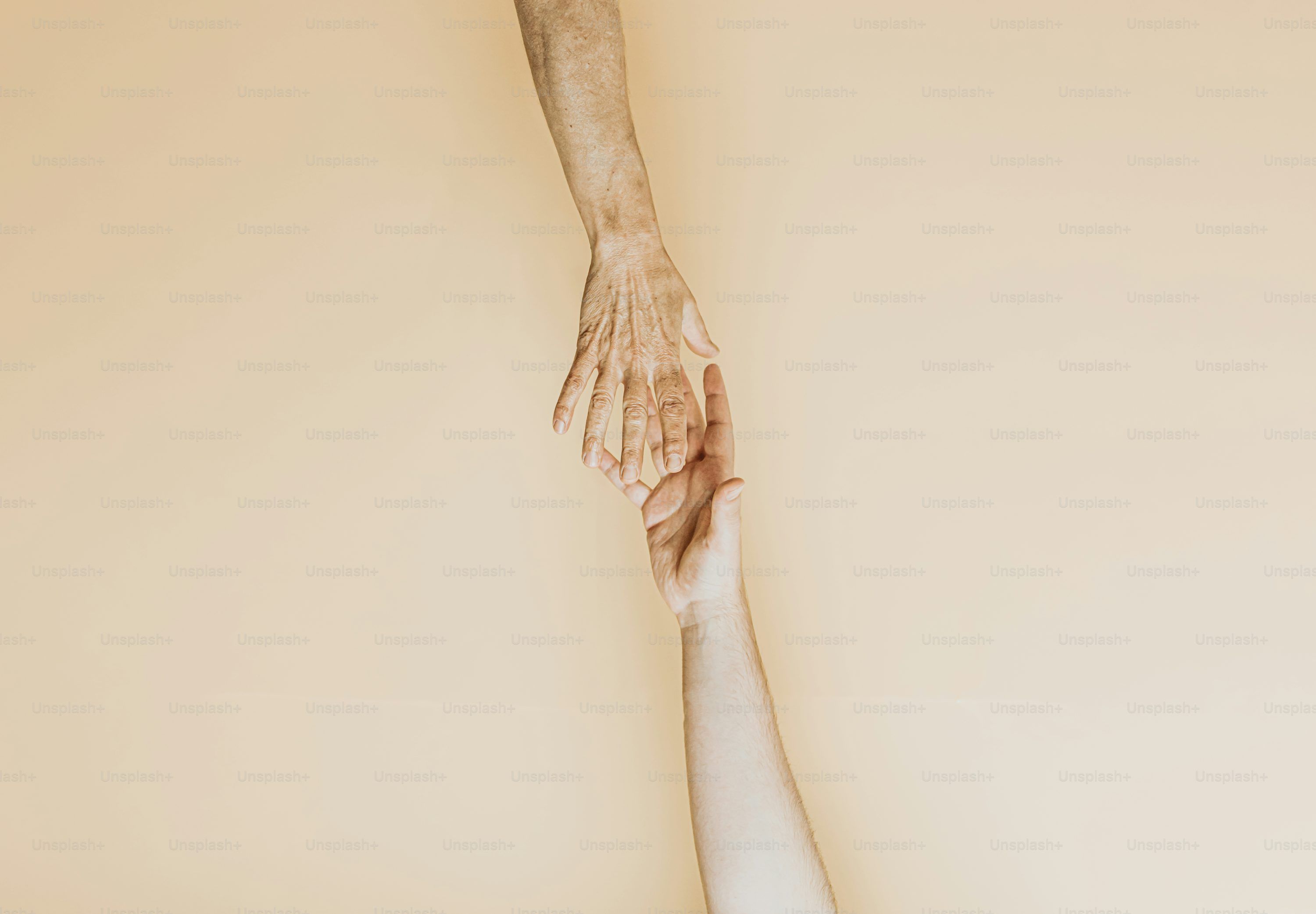 3000x2083 Two hands reaching for each other