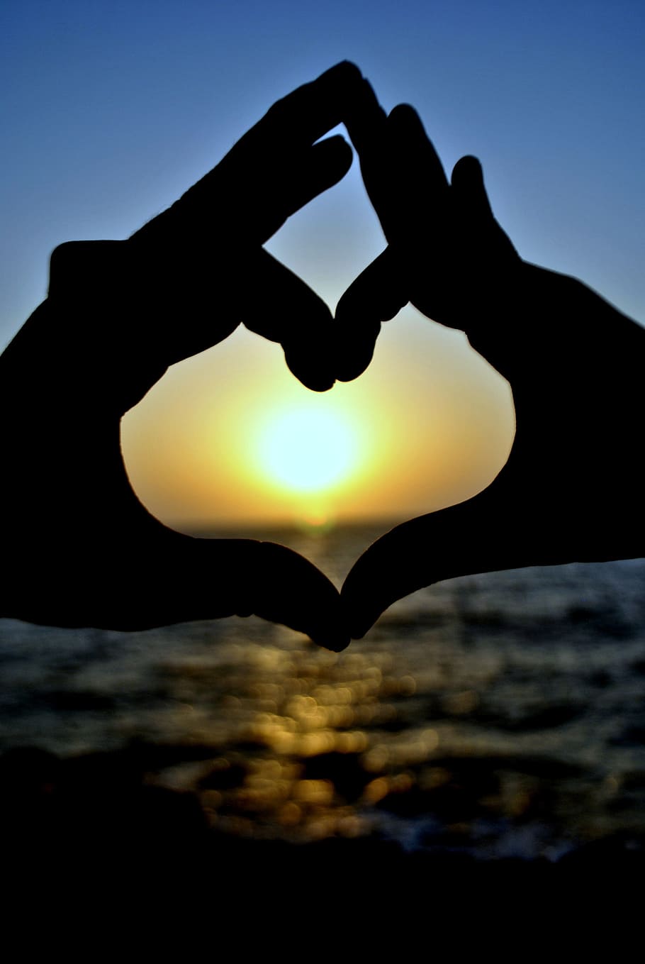 910x1359 HD wallpaper: silhouette of two hands