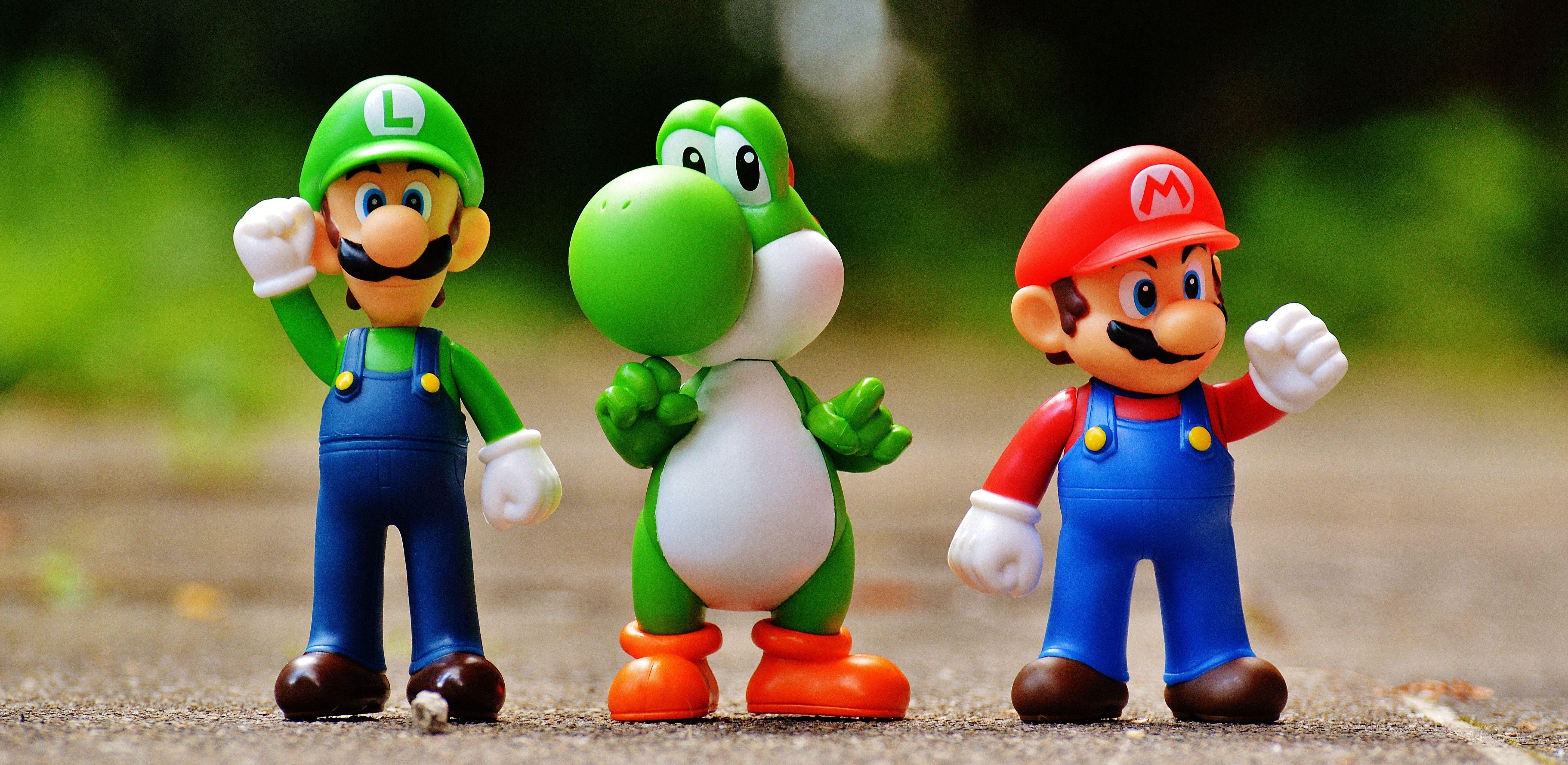 5764x2813 Focus Photo of Super Mario, Luigi, and Yoshi Figurines