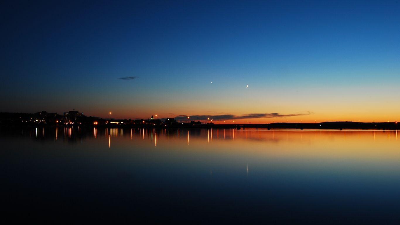 1366x768 Download wallpaper 1366x768 sunset, lake, skyline, night