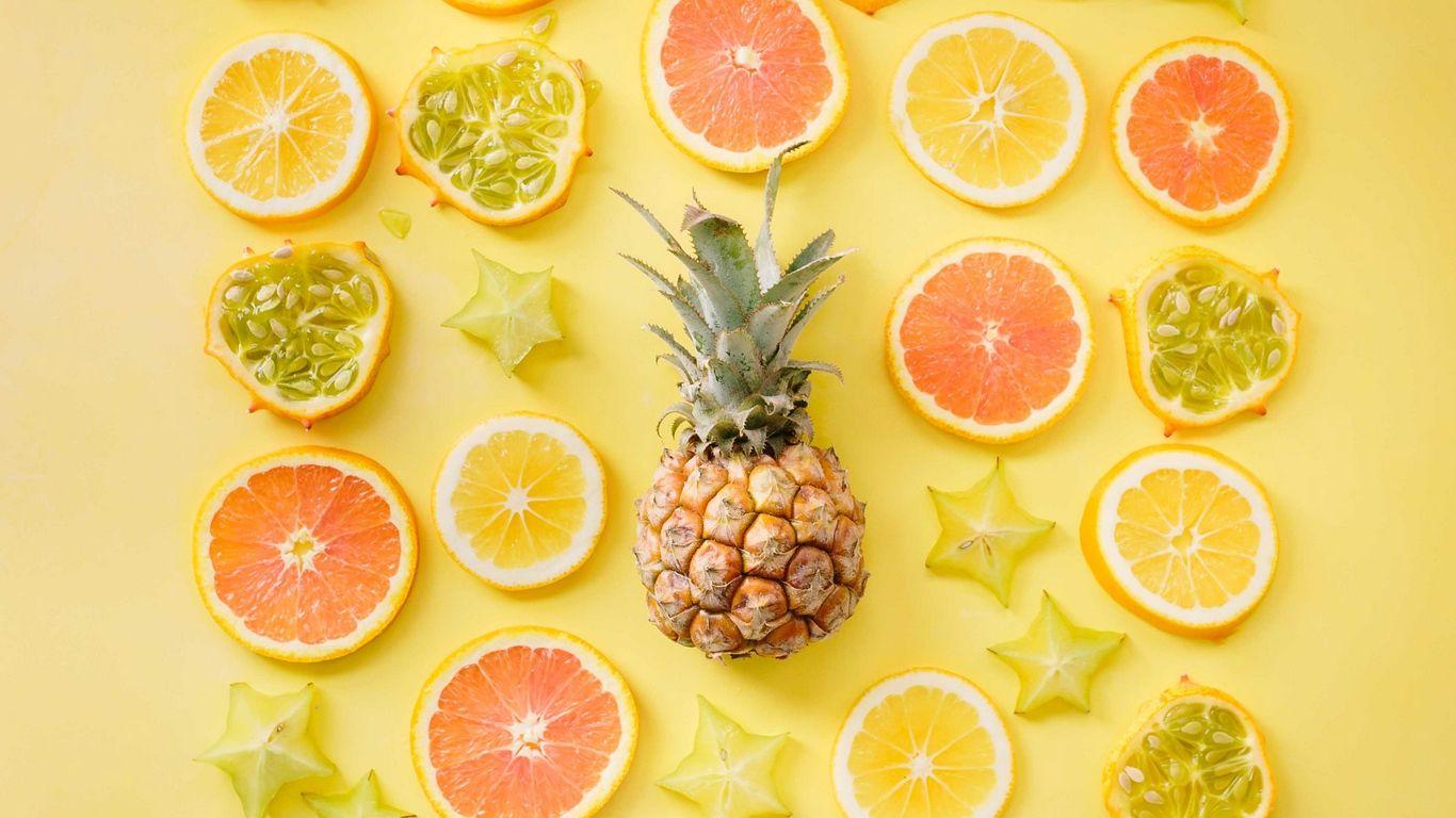 1366x768 Download wallpaper 1366x768 fruit, citrus, pineapple, yellow
