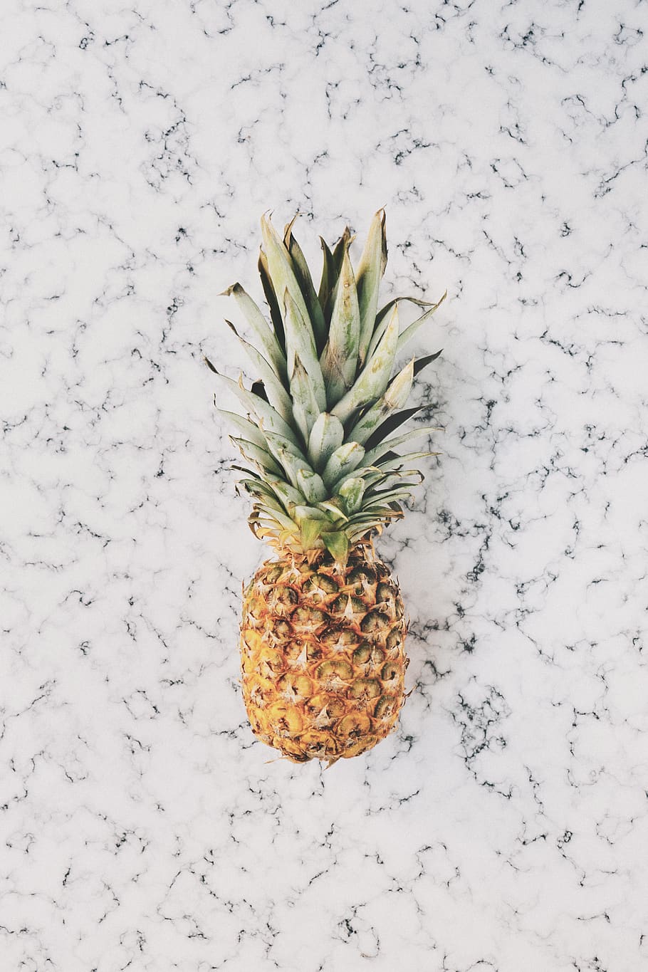910x1365 HD wallpaper: A pineapple sitting on a white countertop., fruit