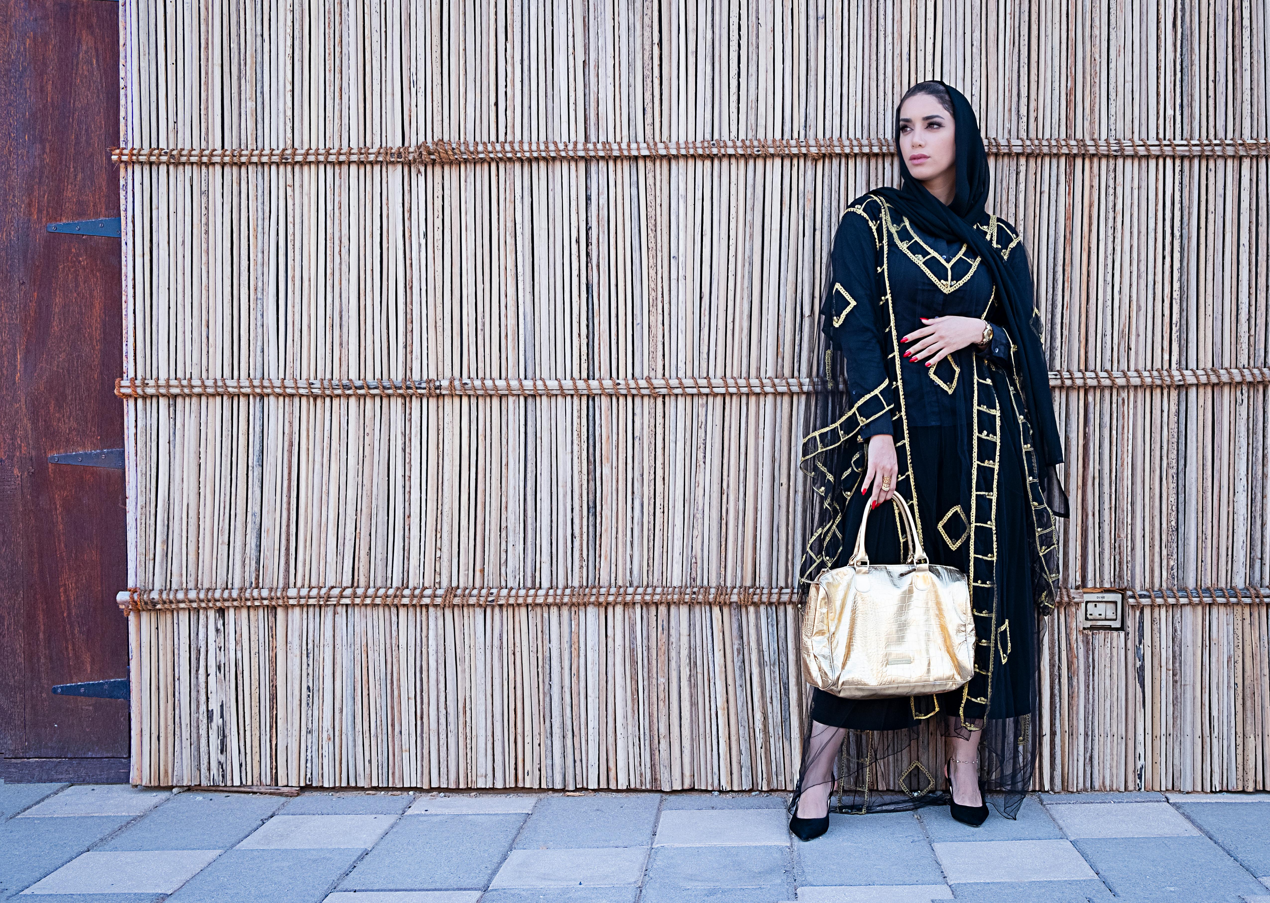 5102x3628 Long Sleeved Dress Holding A Yellow Bag