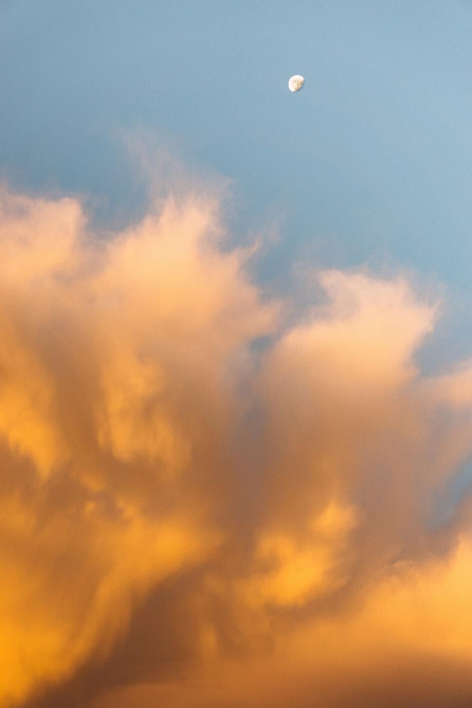 970x1455 Photo of Moon in golden hour cloudscape