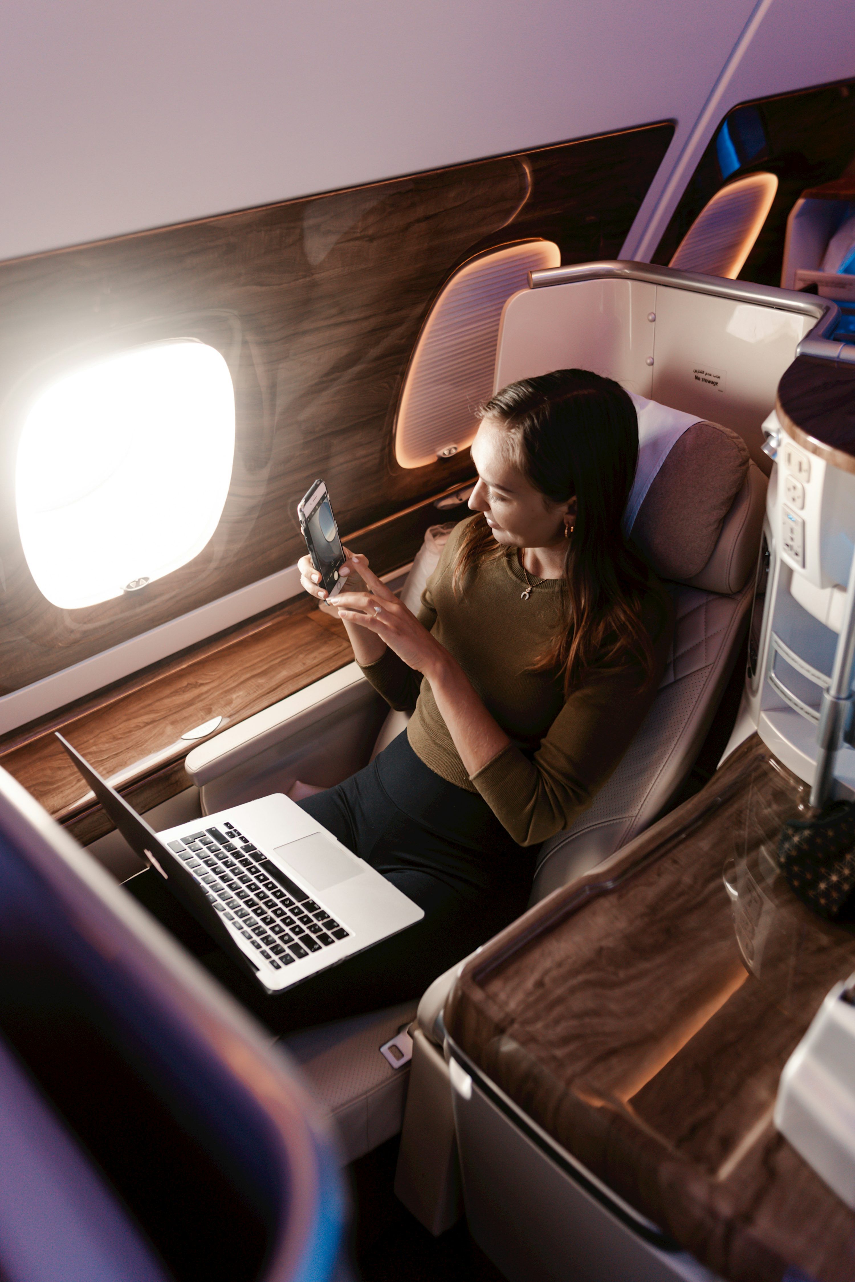 3000x4499 A seat on a plane with a tablet on it