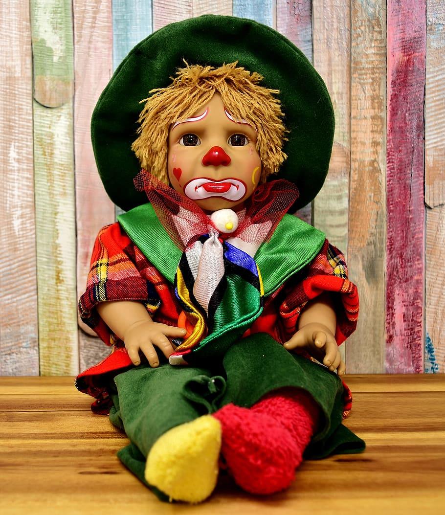 910x1053 HD wallpaper: jester boy with green hat doll, clown, cute, sad, children, colorful