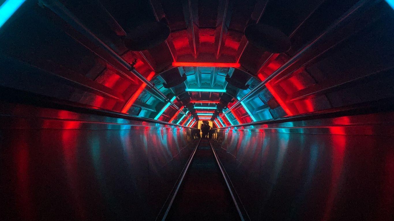 1366x768 Download wallpaper 1366x768 escalator, tunnel, dark, neon