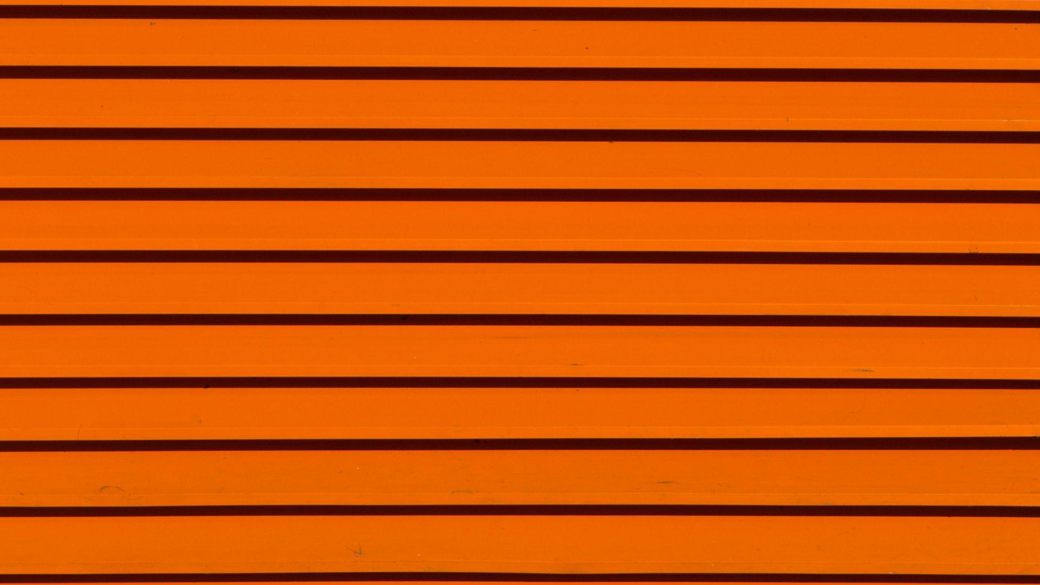 2048x1152 Download wallpaper 2048x1152 lines, orange, texture, surface