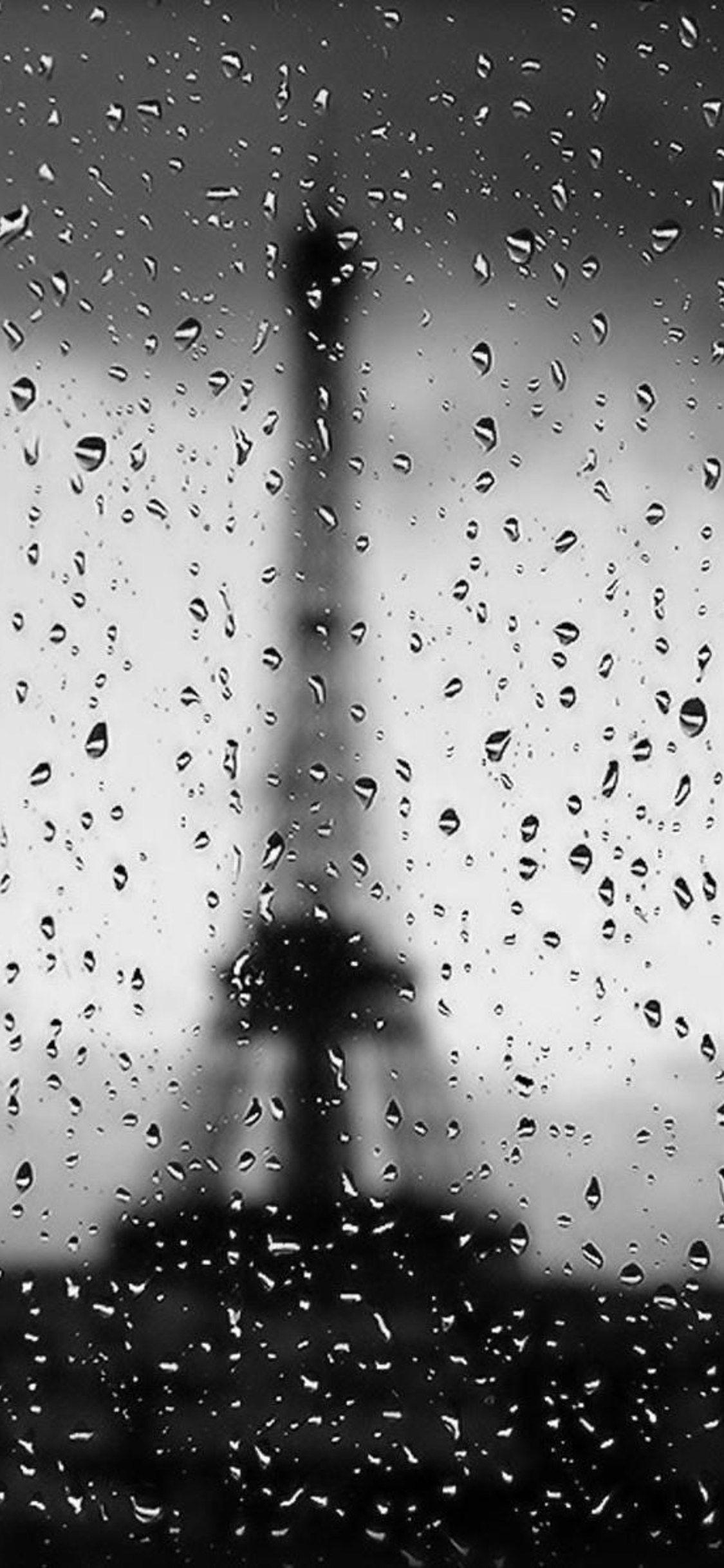 1125x2436 Eiffel Tower Rain Drops Image Wallpaper For Mobile