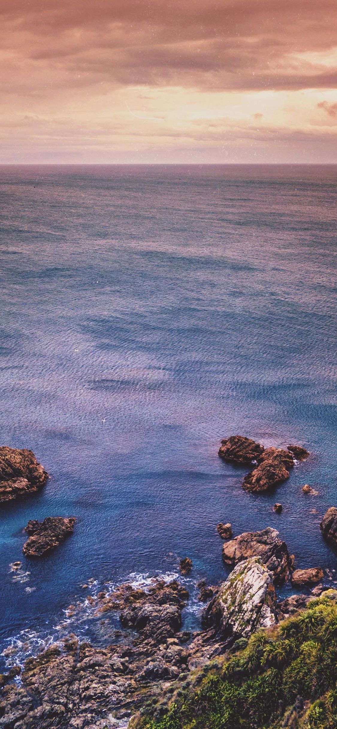 1125x2436 Cliff Sea Ocean Rock Nature Blue