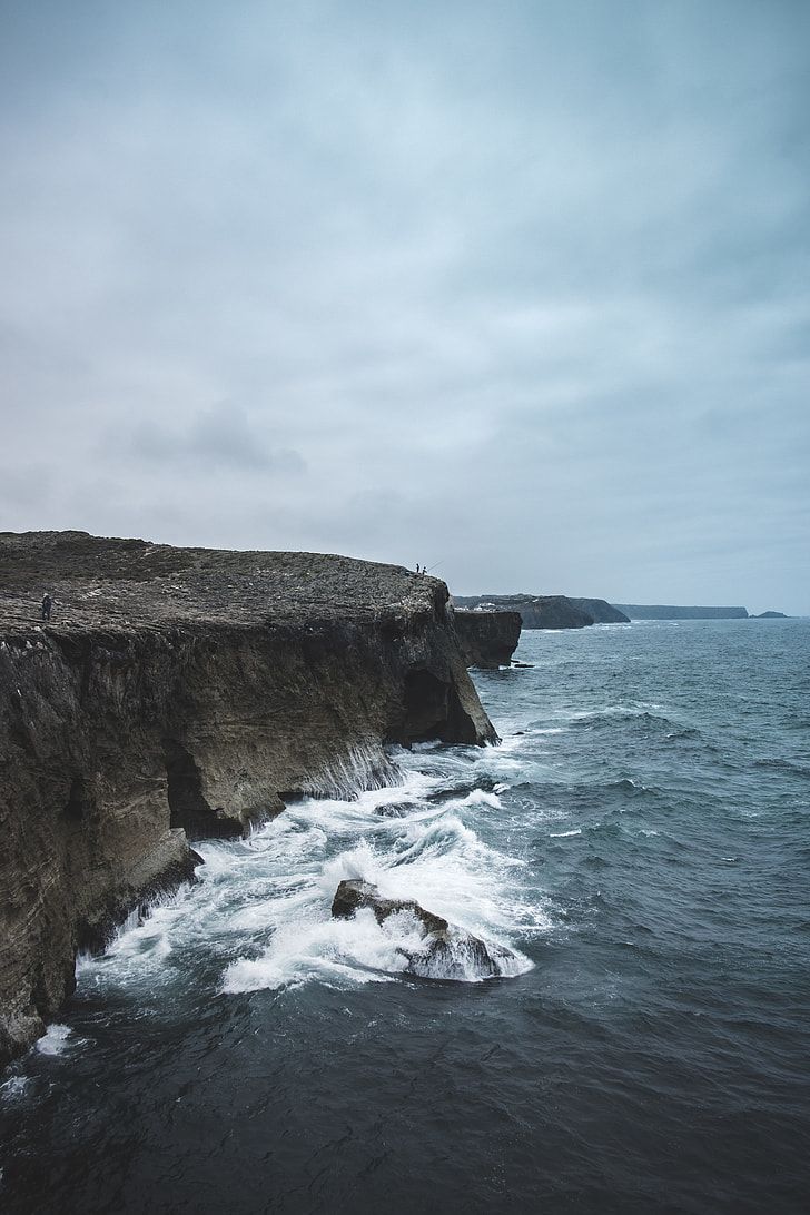 728x1092 Rock formation on the ocean
