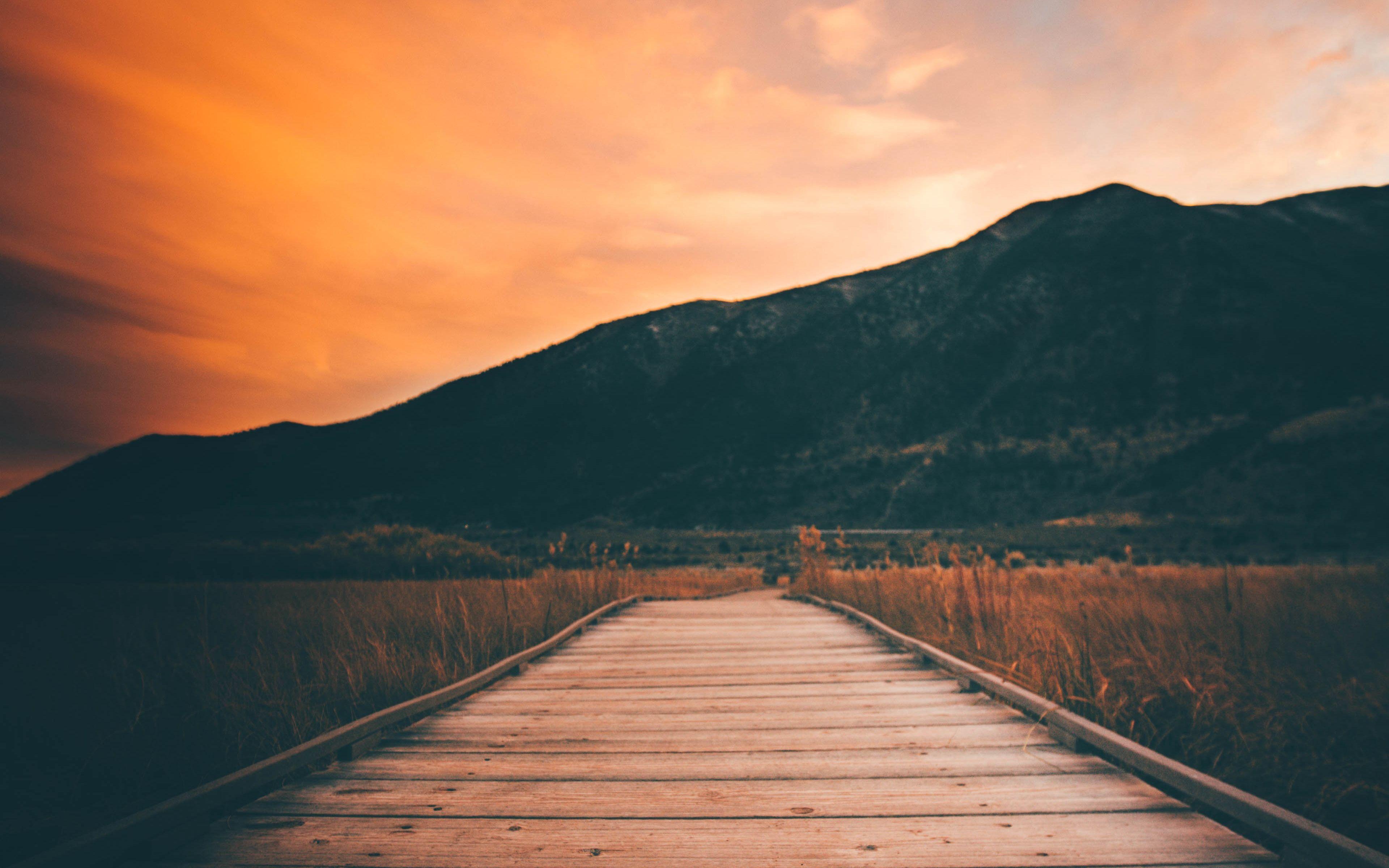 3840x2400 Download wallpaper 3840x2400 pier, mountains, sunset