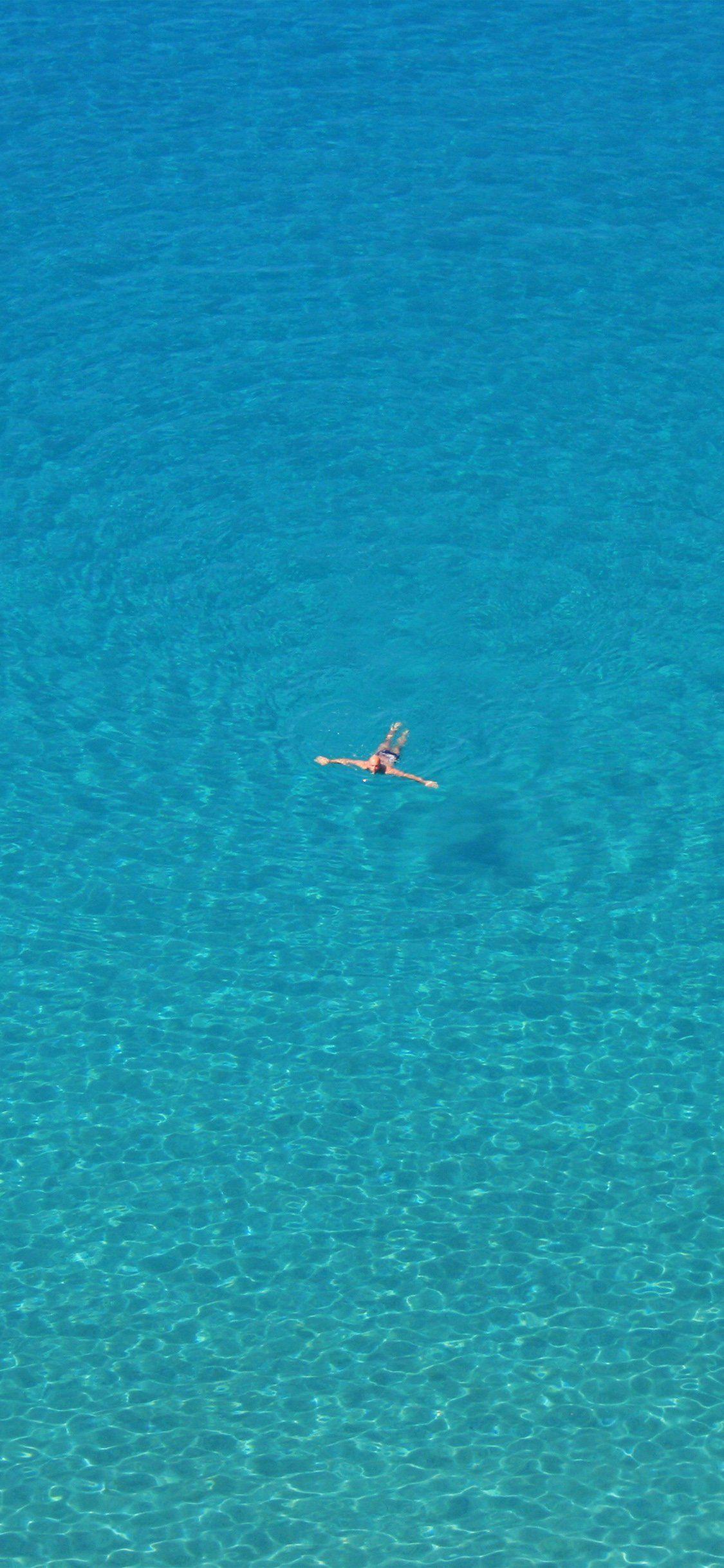 1125x2436 Ocean sea blue swim vacation simple iPhone X Wallpaper Free