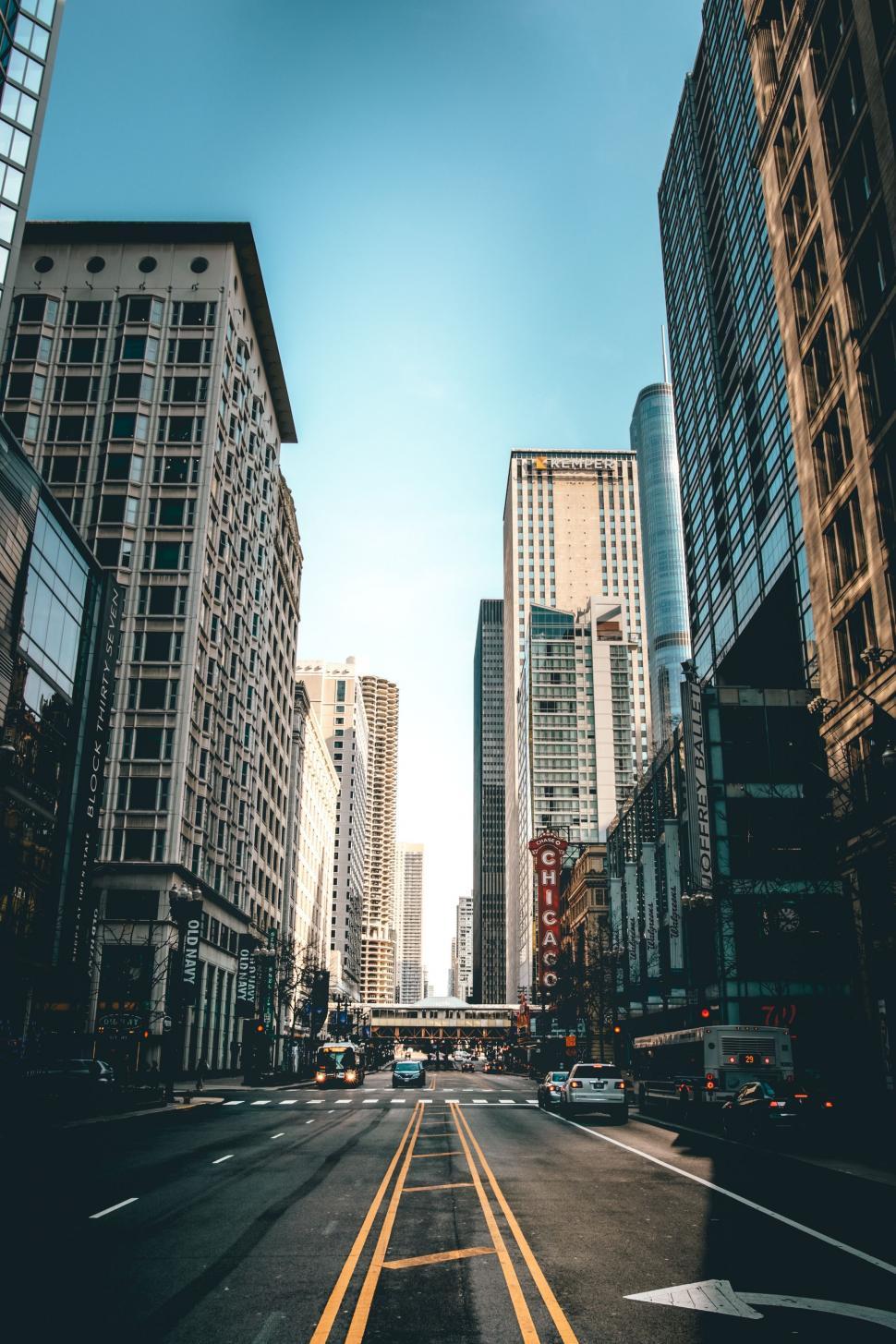 970x1455 Street With Tall Buildings and Traffic