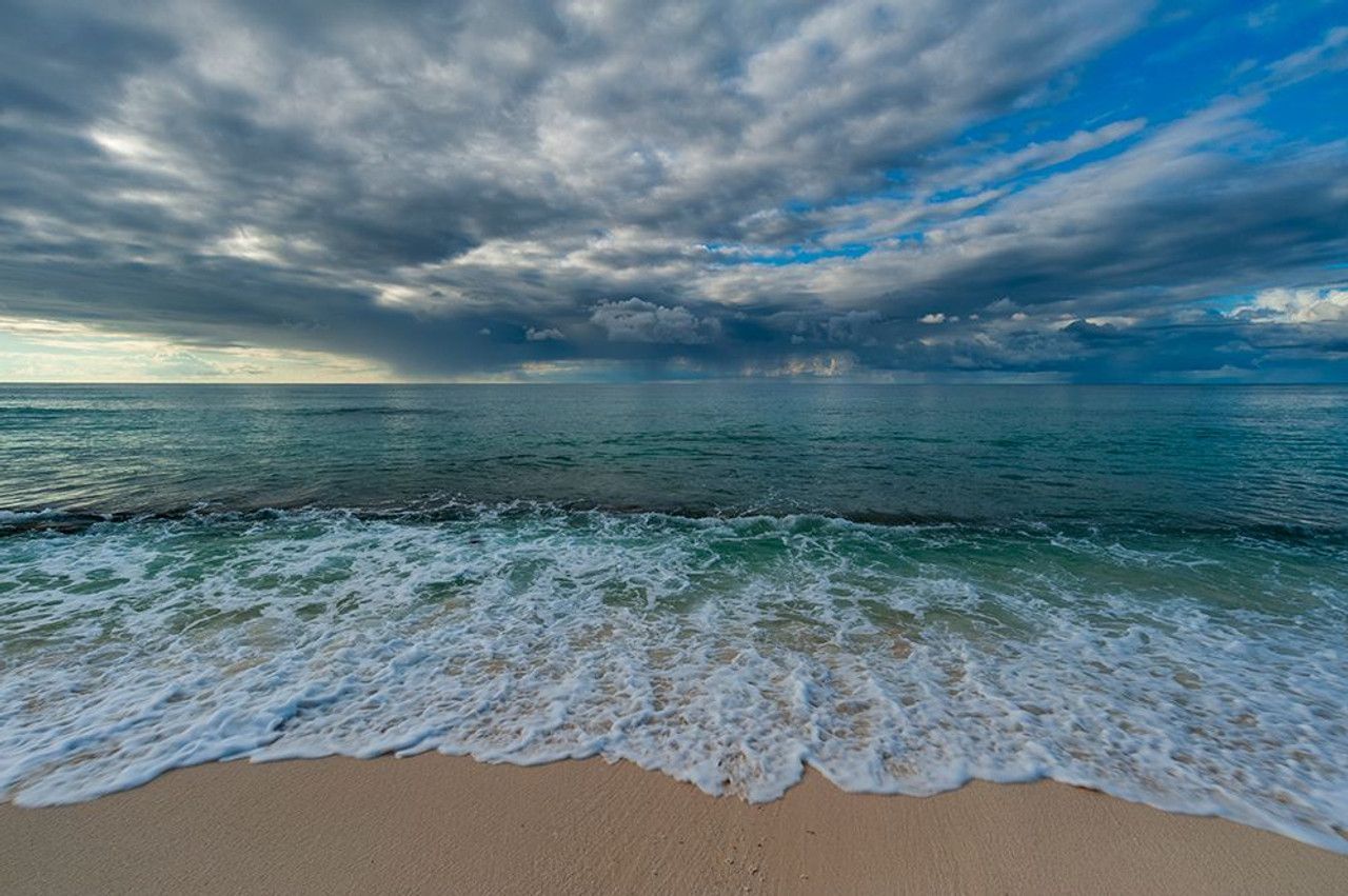 1280x851 Indian Ocean Surf On A Sandy Beach Under A Dramatic Cloud Filled Sky Denis Island Seychelles Poster Print