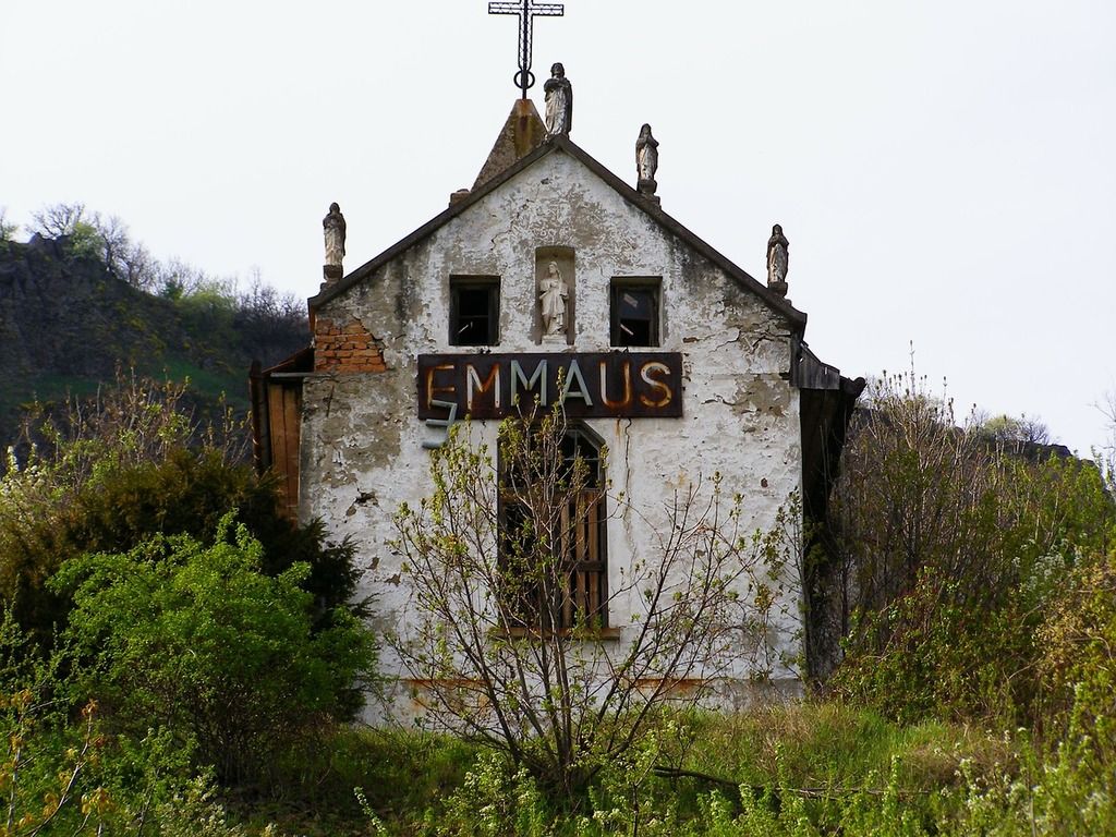 1024x768 An old church with a cross on top of it