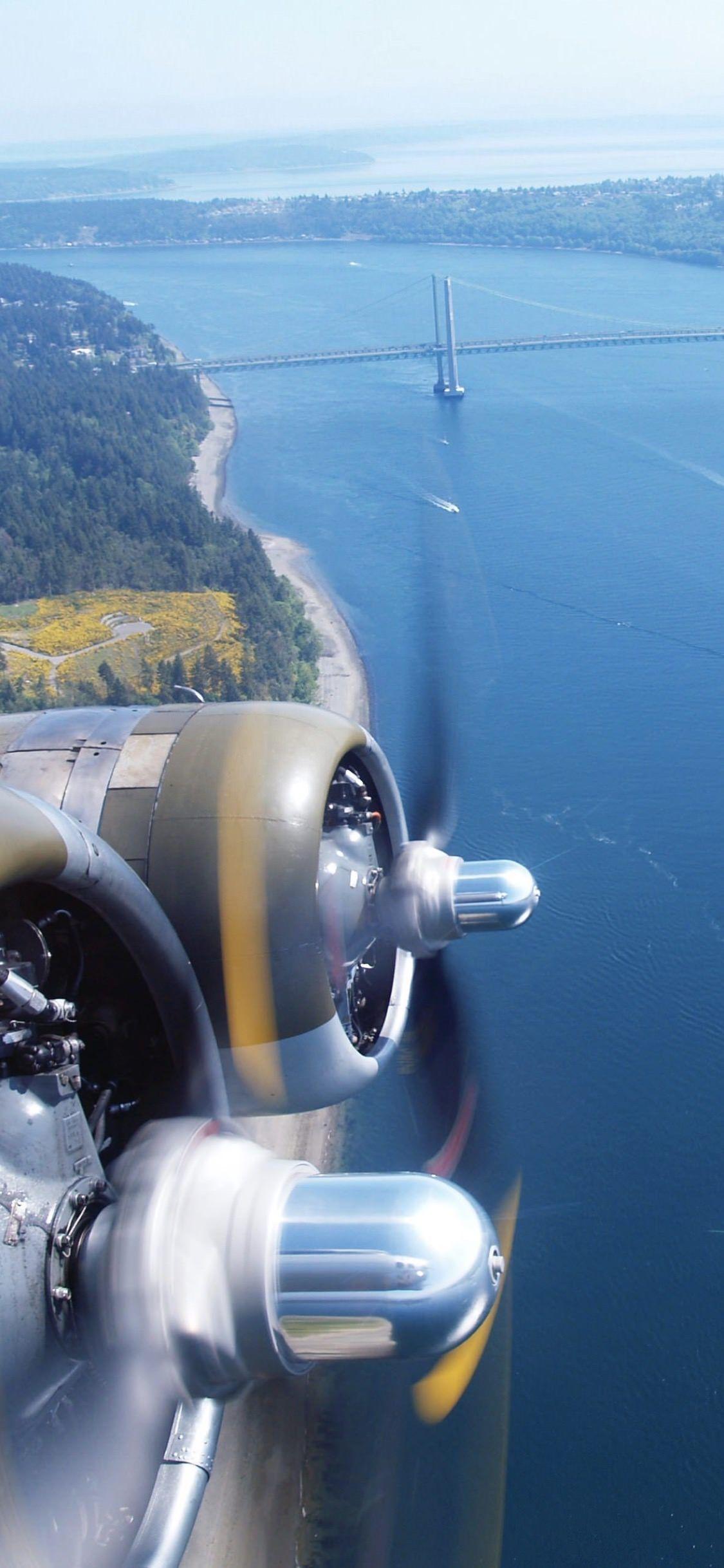 1125x2436 Landscape sea sky airplane. wallpaper.sc iPhoneXS