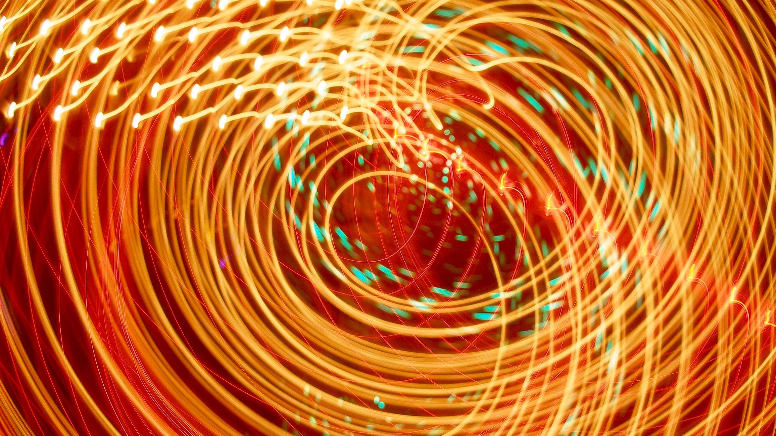 2560x1440 Download wallpaper 2560x1440 rays, neon, glow, swirling