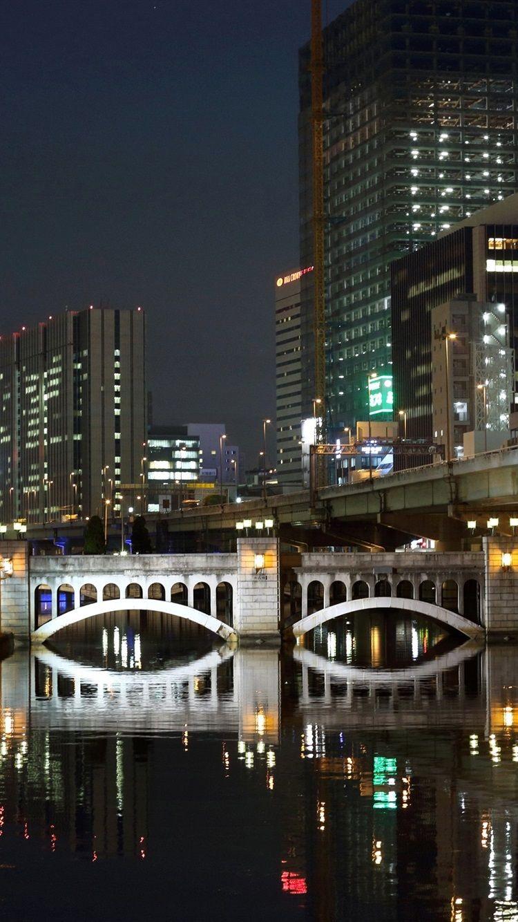 750x1334 Wallpaper Fukuoka, Japan, night, city, skyscrapers, river
