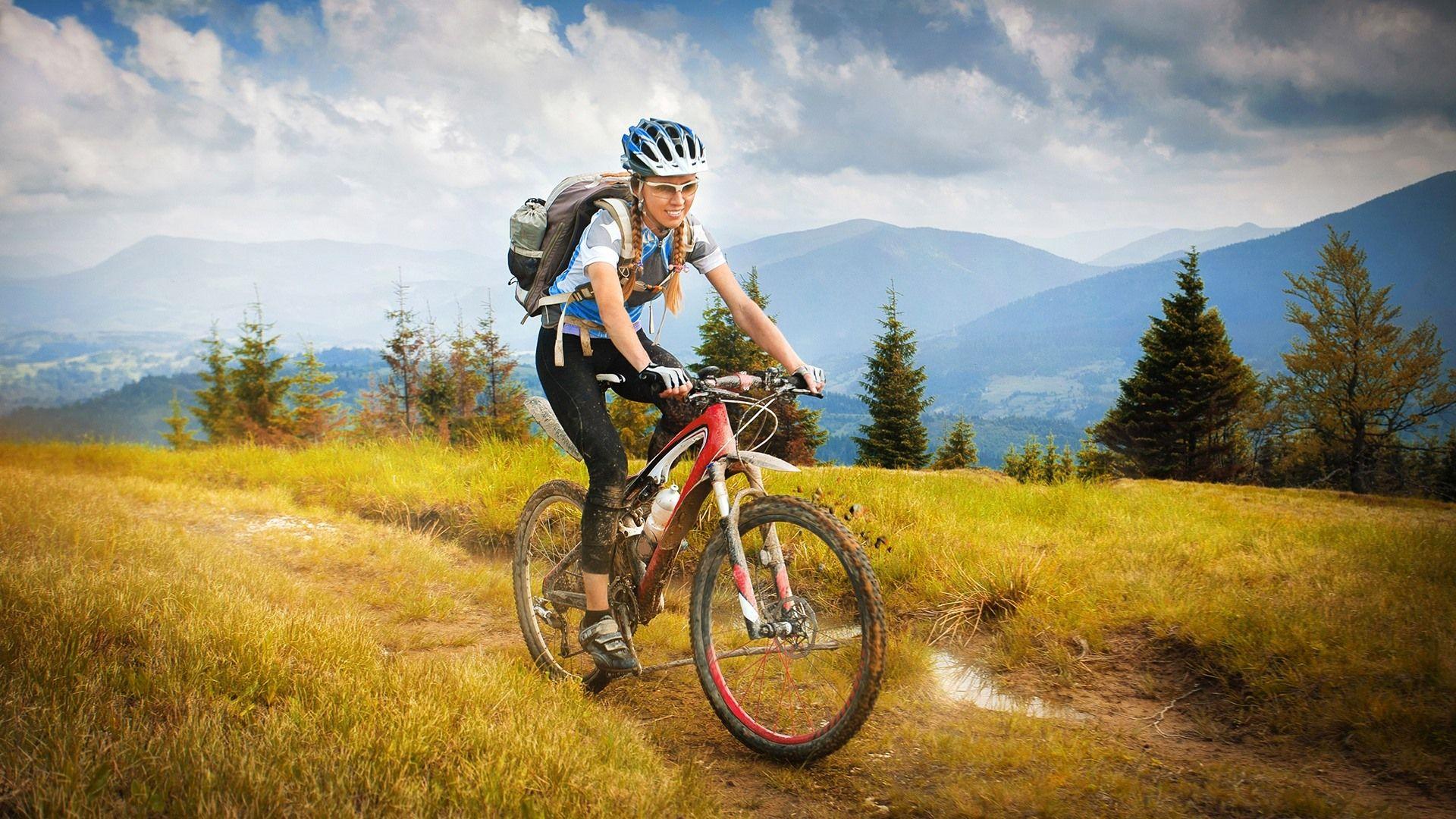 1920x1080 Wallpaper Girl ride bike, travel, grass, trees, mountains