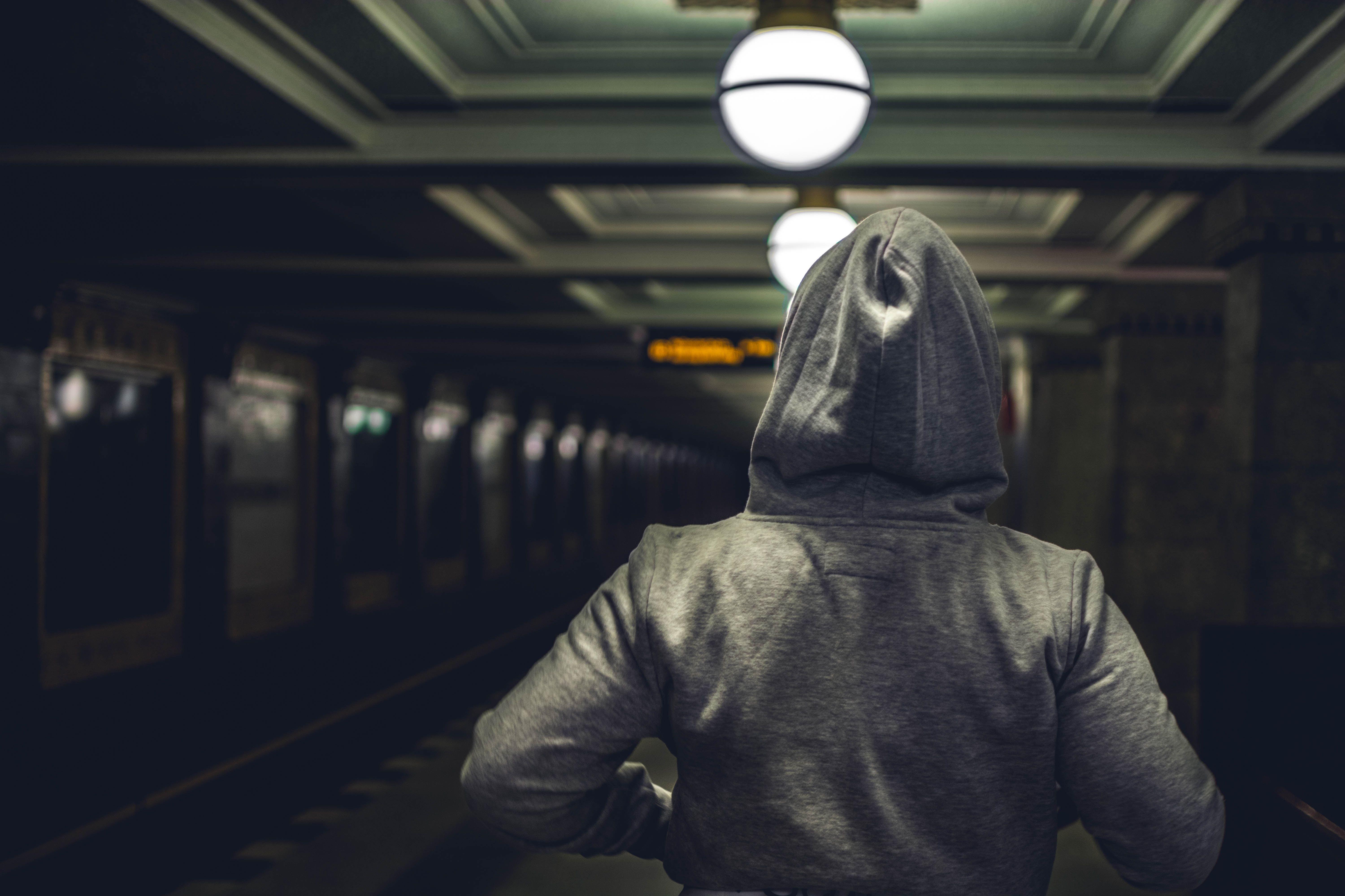 6000x4000 Person Wearing Gray Hooded Jacket in Train Station · Free