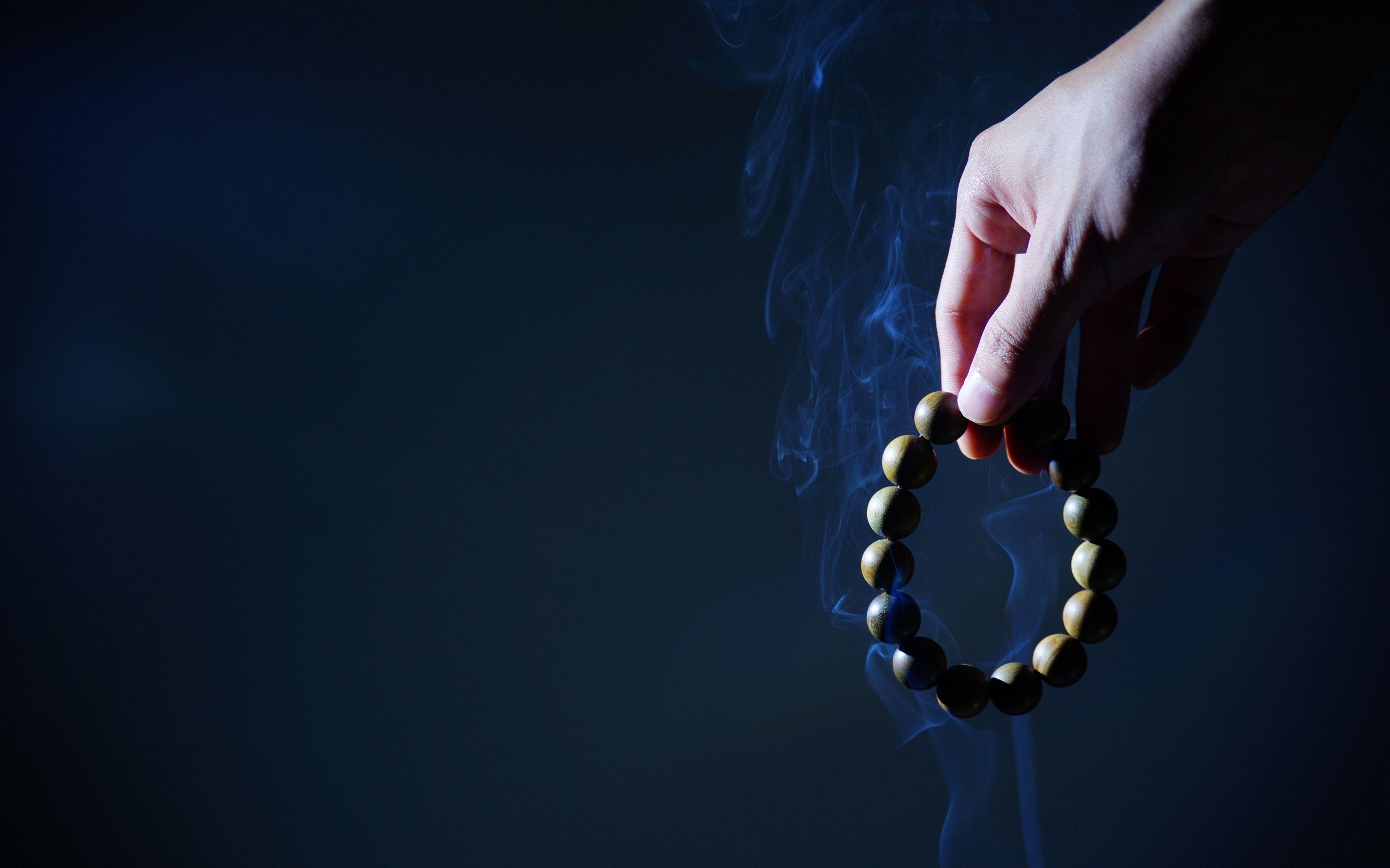 3840x2400 Download wallpaper 3840x2400 rosary, hand, smoke 4k ultra HD
