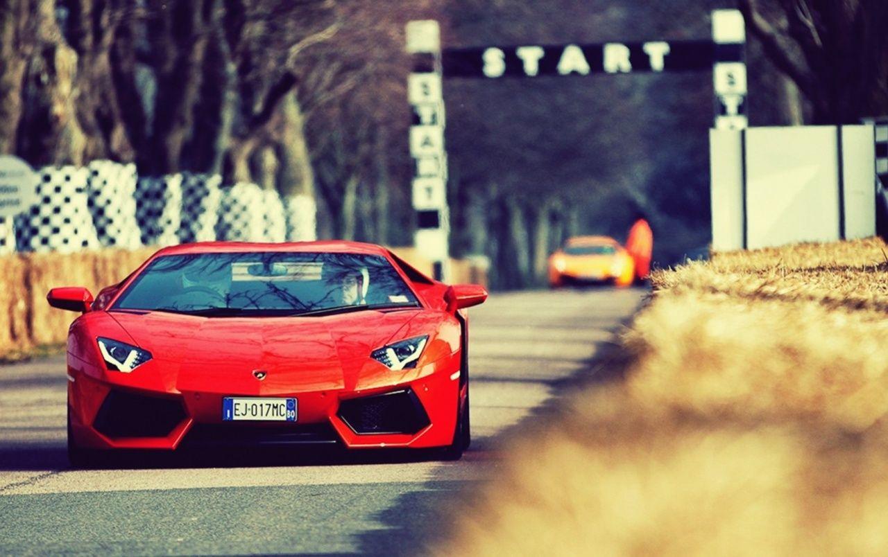 1280x804 Orange Lamborghini Aventador on the Track wallpaper