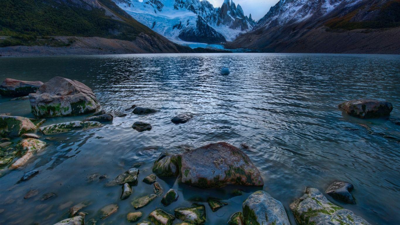 1366x768 Mountain Lake Argentina Rocks Wilderness Travel Scenery HD Wallpaper