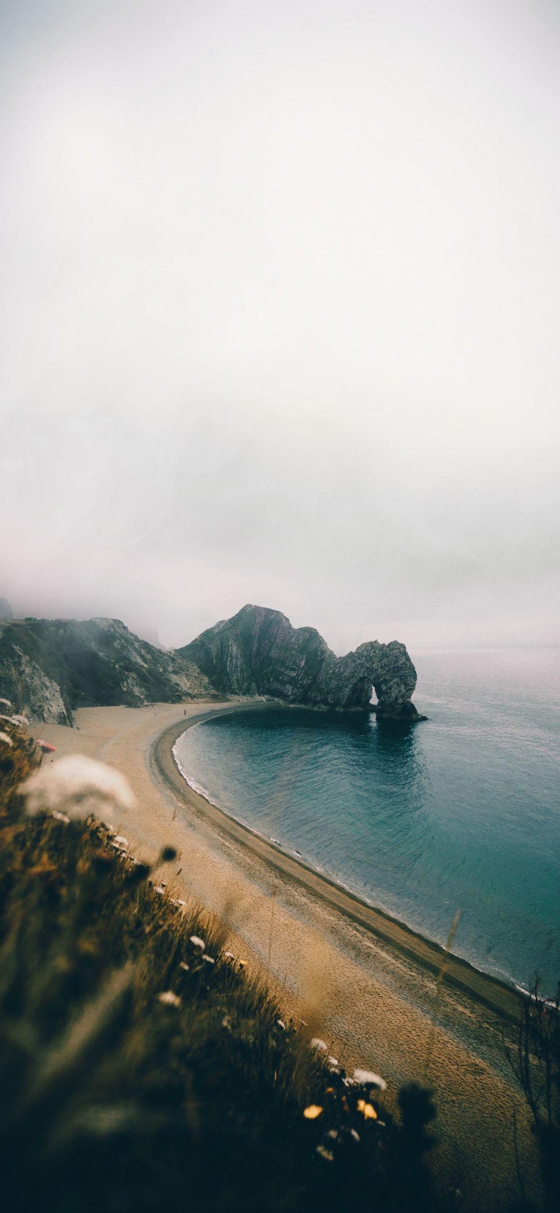 1125x2436 Download 1125x2436 wallpaper durdle door, arch, coast, uk