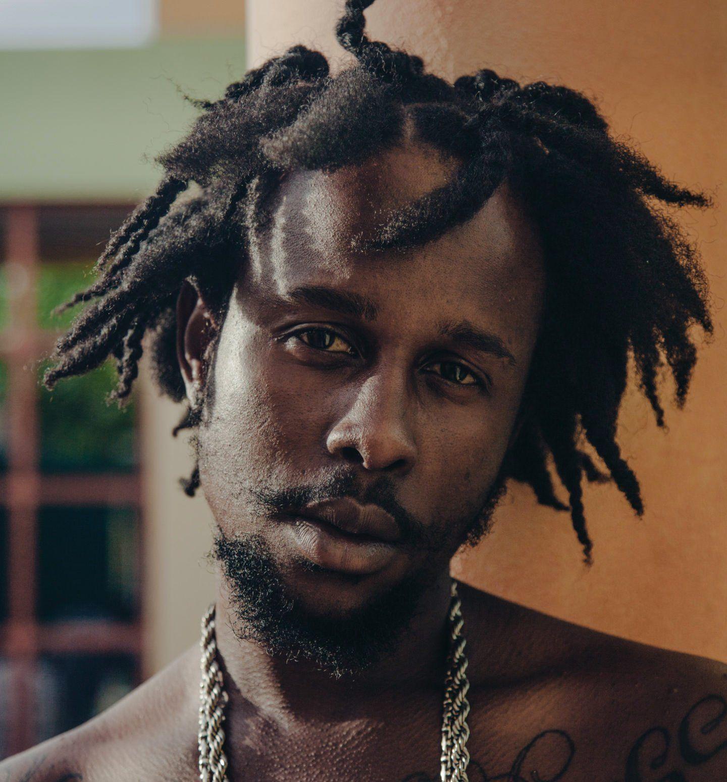 The 33-year old son of father (?) and mother Miss Rhona Popcaan in 2022 photo. Popcaan earned a  million dollar salary - leaving the net worth at  million in 2022