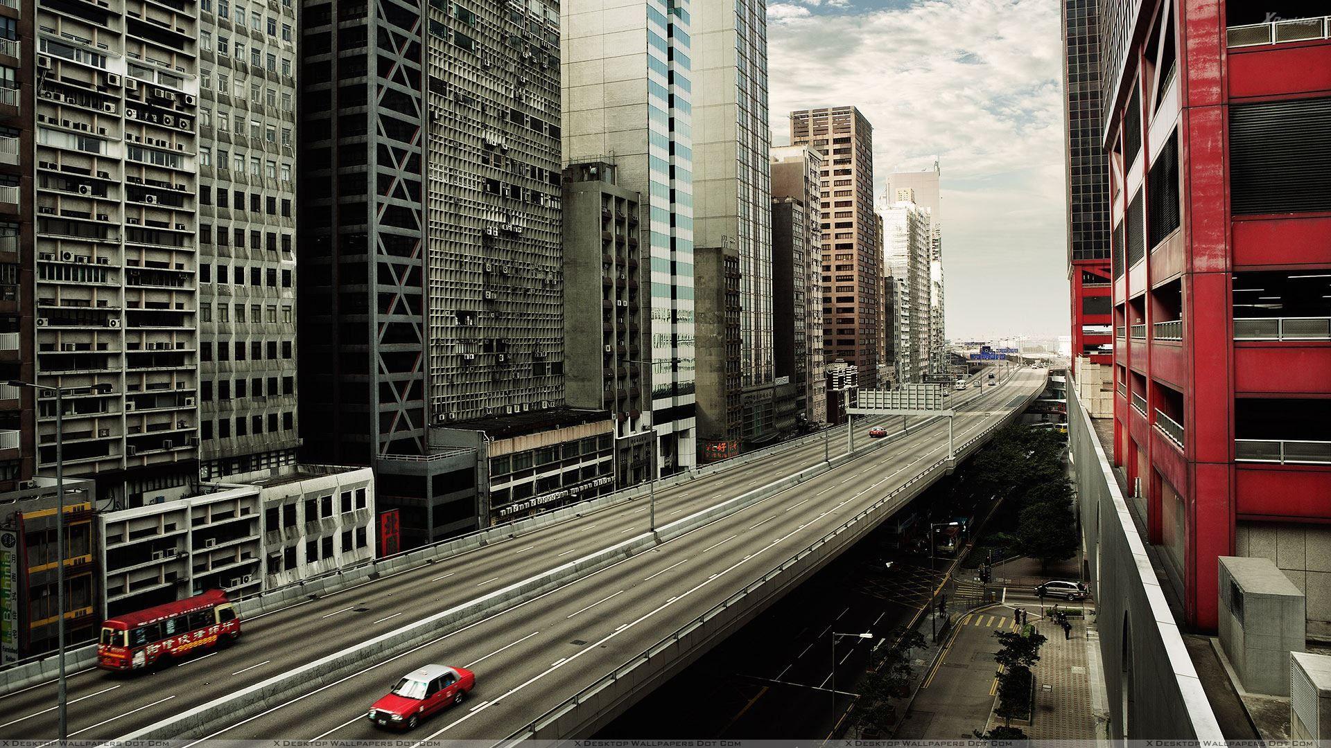 1920x1080 Red Car And Buildings in City Wallpaper