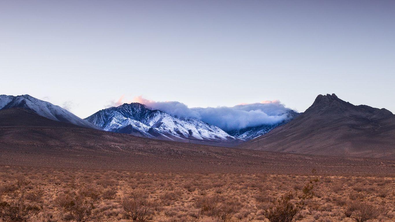 1366x768 Download wallpaper 1366x768 mountains, desert, sky tablet