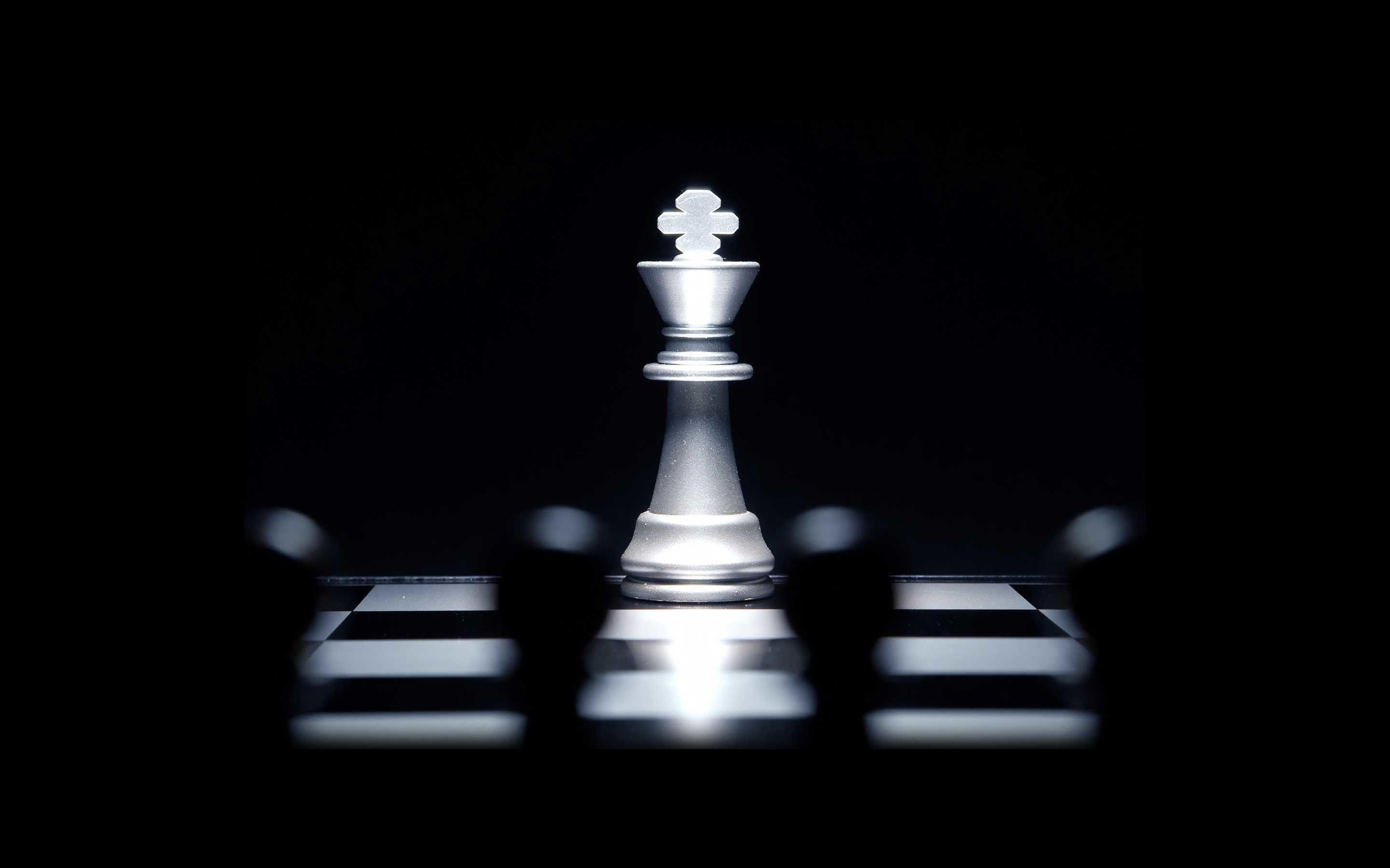 Closeup king chess piece defeated enemy or trade competitor by checkmate at  end of chessboard game. Businessman moving chess to success competition by  Stock Photo - Alamy
